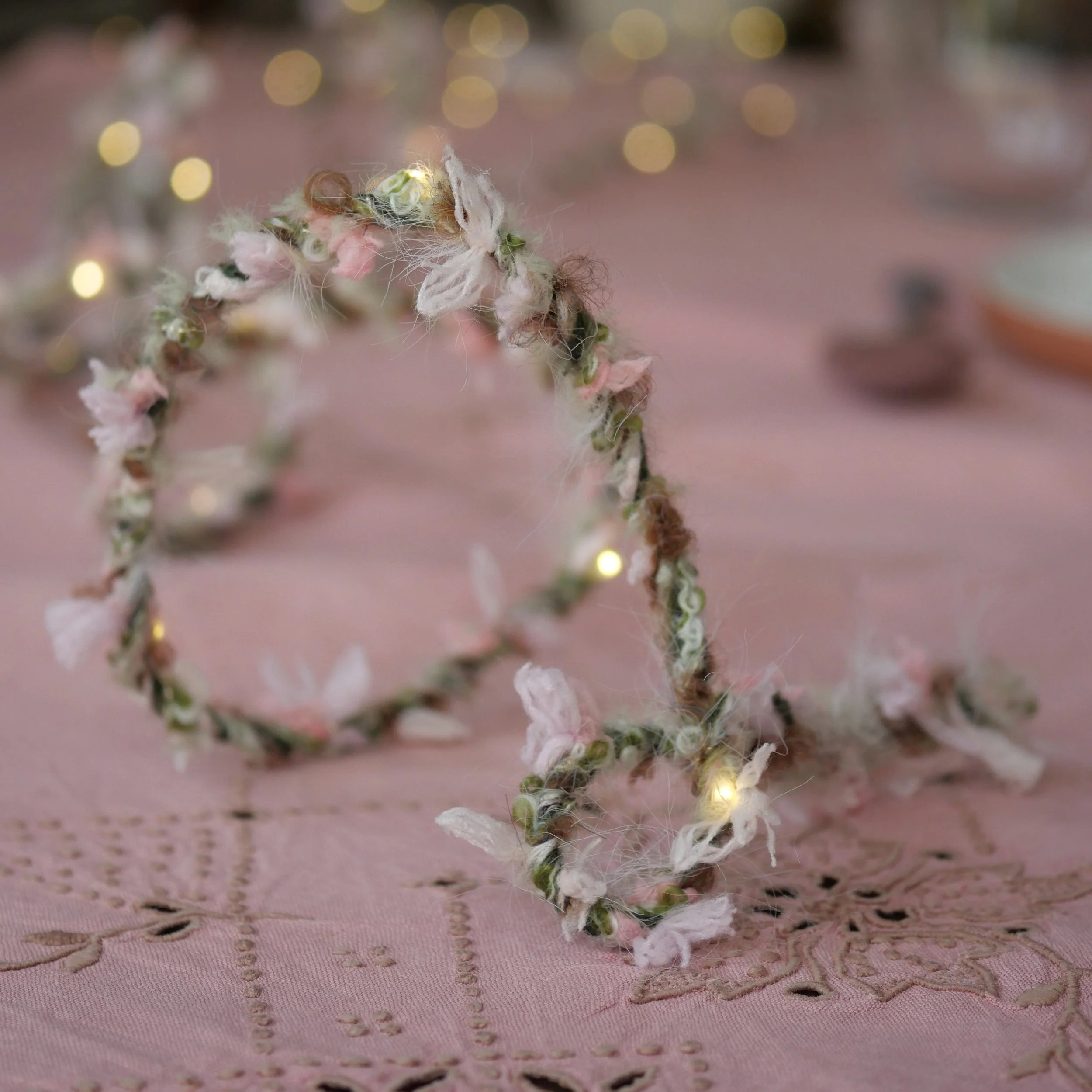Wild Rose Hedgerow Fairy Lights with soft pink and green textured yarn and warm white LEDs