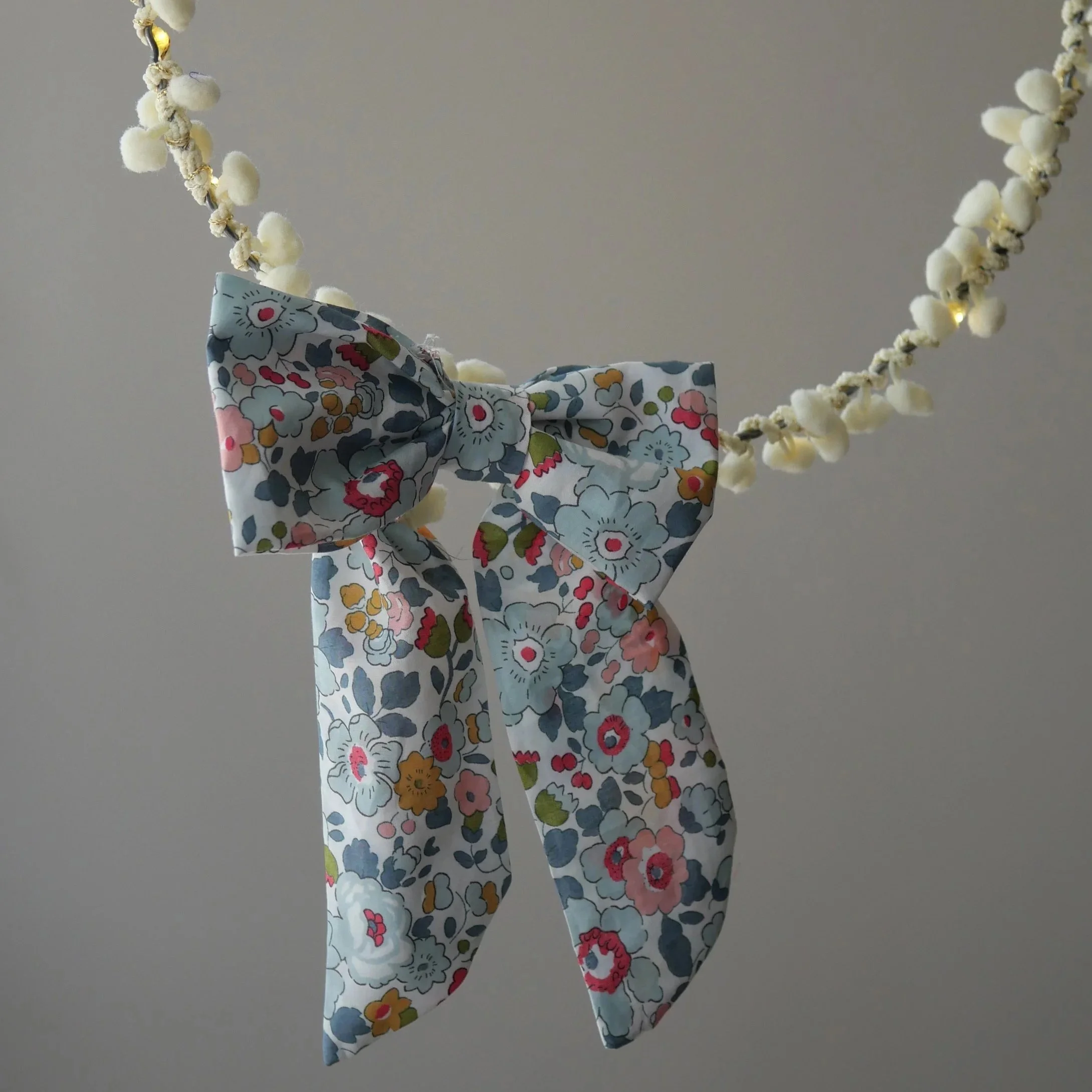Liberty floral fabric bow battery pack cover on handmade fairy lights