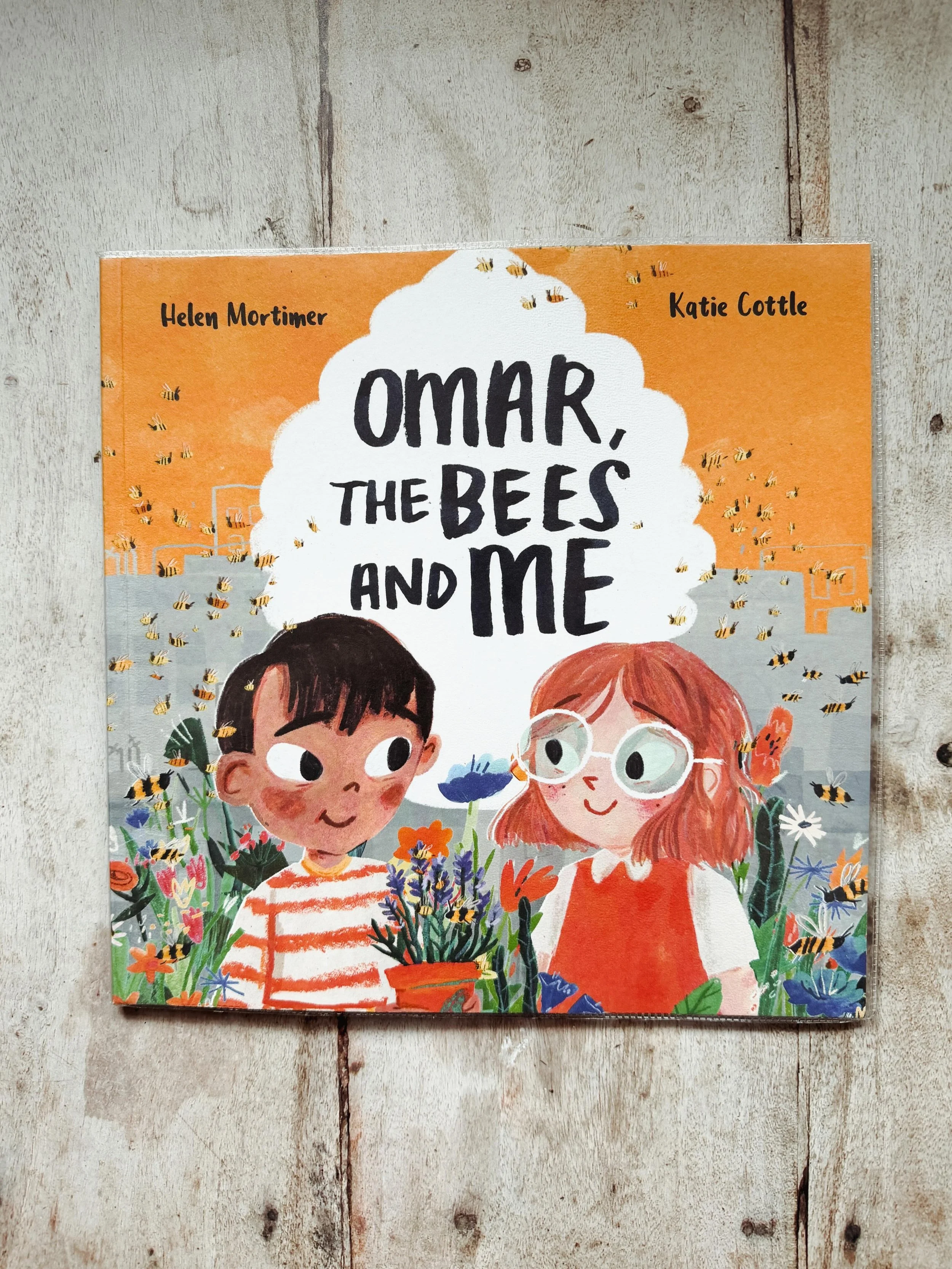 Omar brings in honey cake which reminds him of his beekeeping Grandpa. It sparks a class project to make their town more bee friendly. 
A beautiful book with delightful illustrations while teaching about the importance of bees 🐝