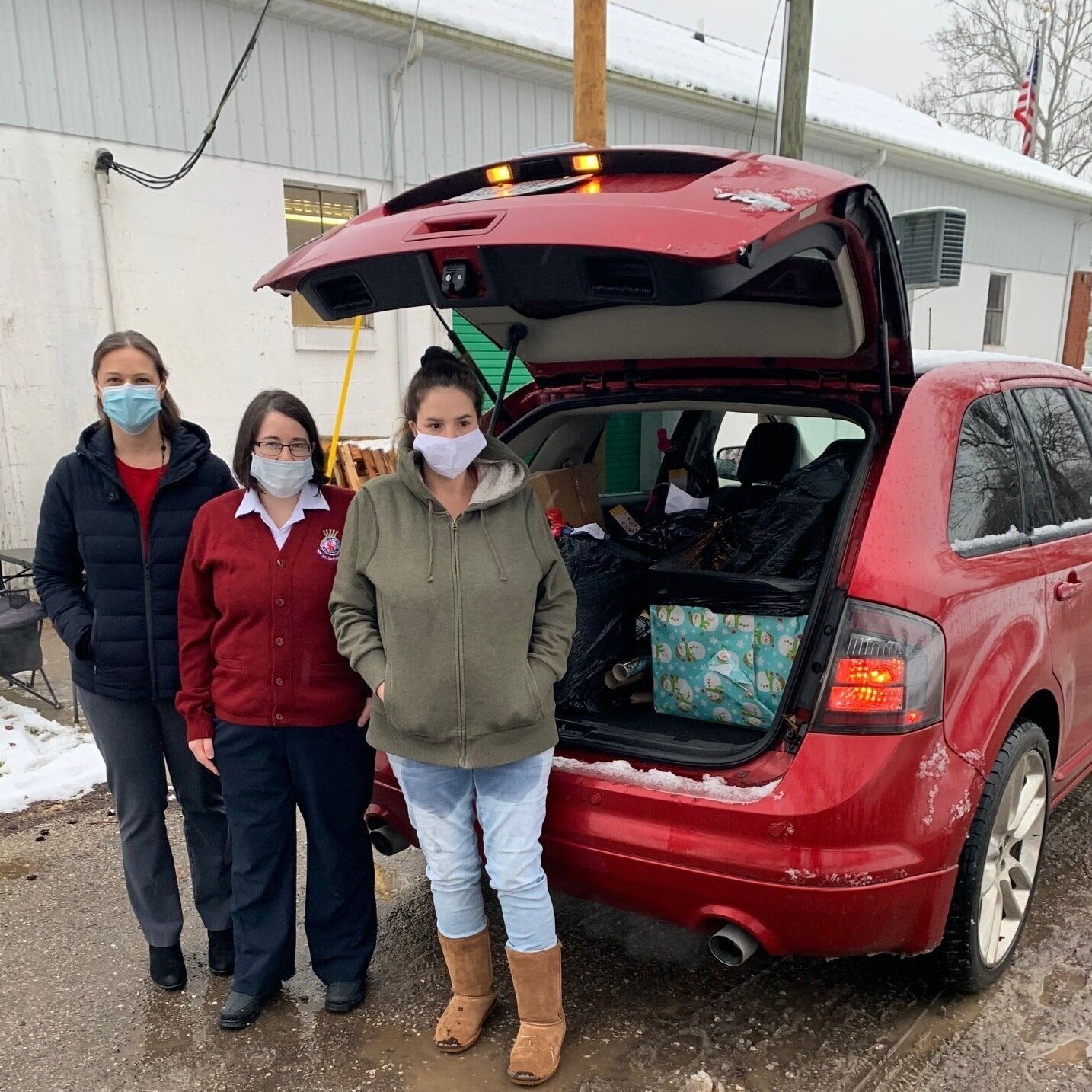  The Foundation and The Salvation Army load presents into a local mother’s car 