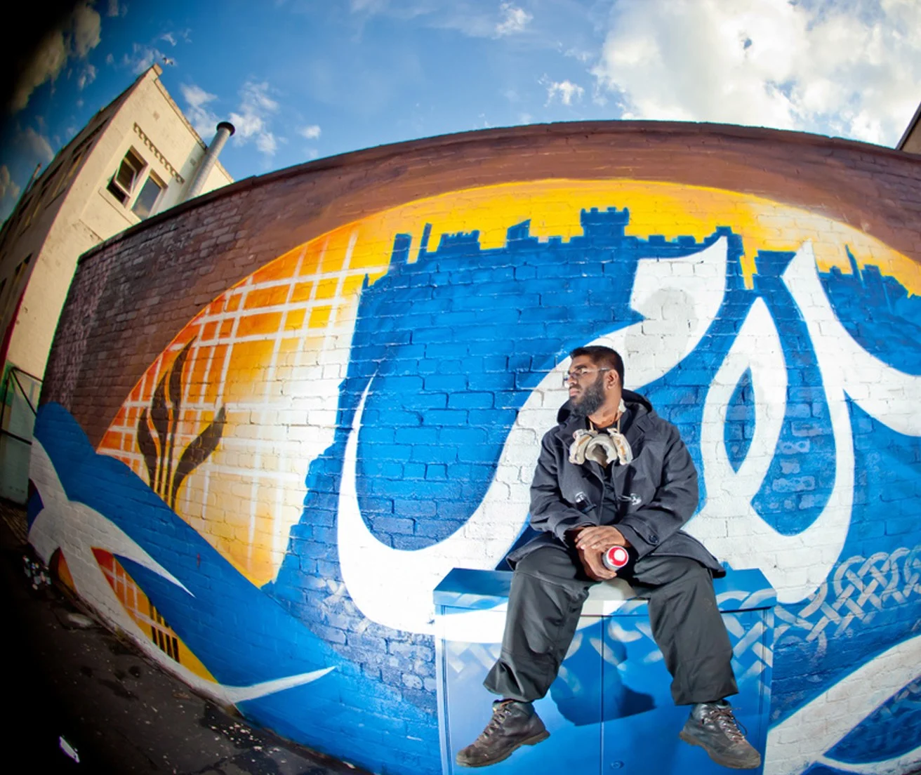 Mohammad Ali with his work in Edinburgh, Scotland.