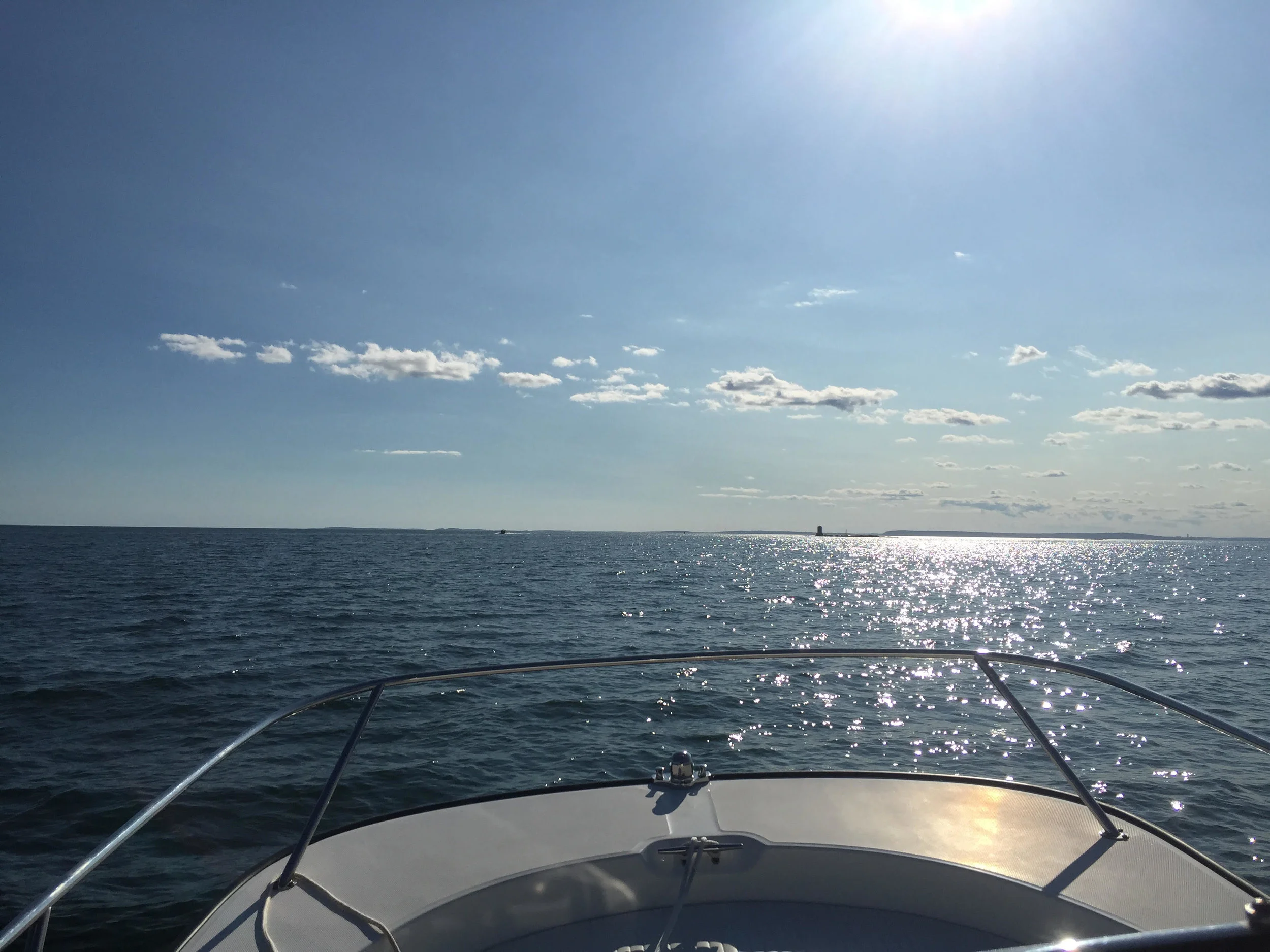 Boston Whaler approaching The Monument, South Penobscot Bay, Maine