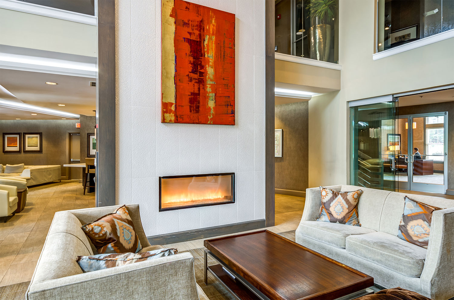 Lobby area at The Bowen apartments with couches and fireplace