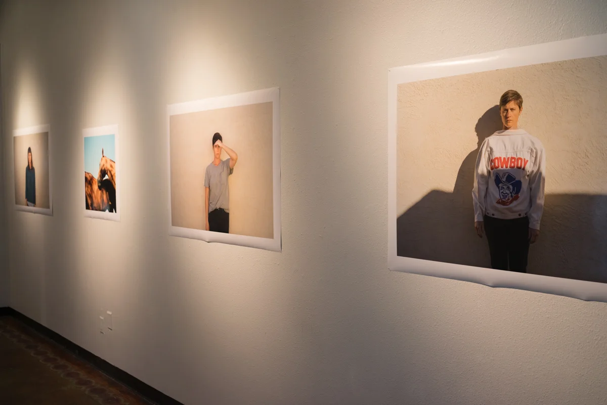 Installation view of long wall in main gallery, prints 40x30 inches and 22x22 inches