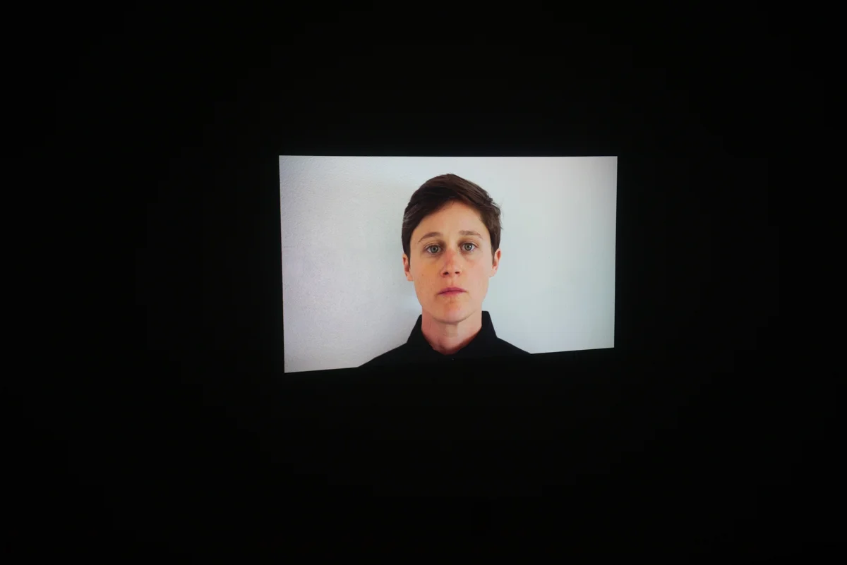 Installation views of three-channel video piece Country Songs