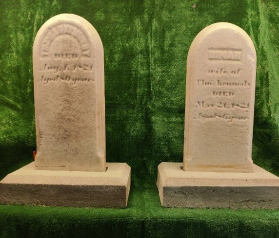 The headstones restored and mounted.