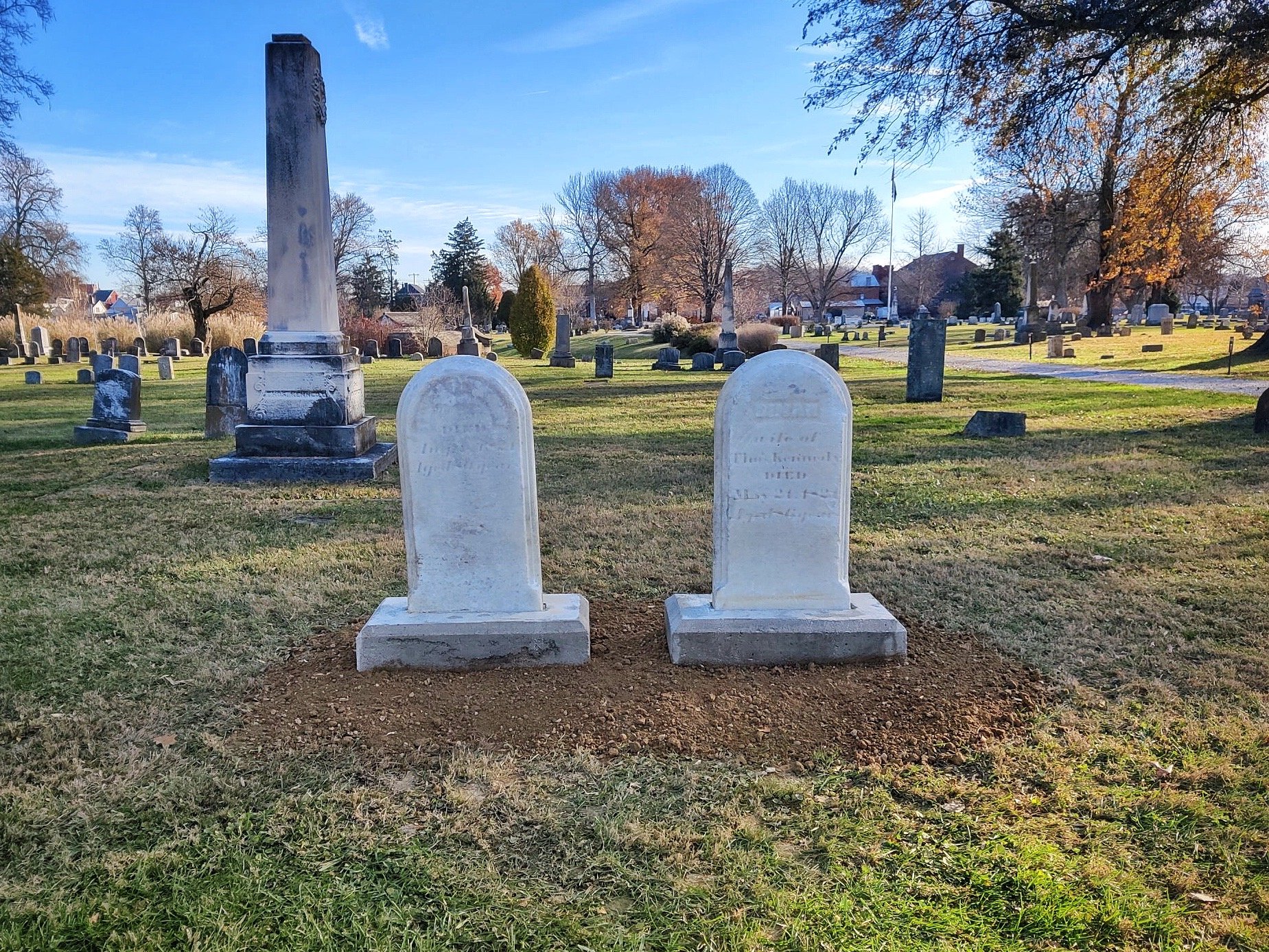 The headstones joined to concrete footers at the burial sites.