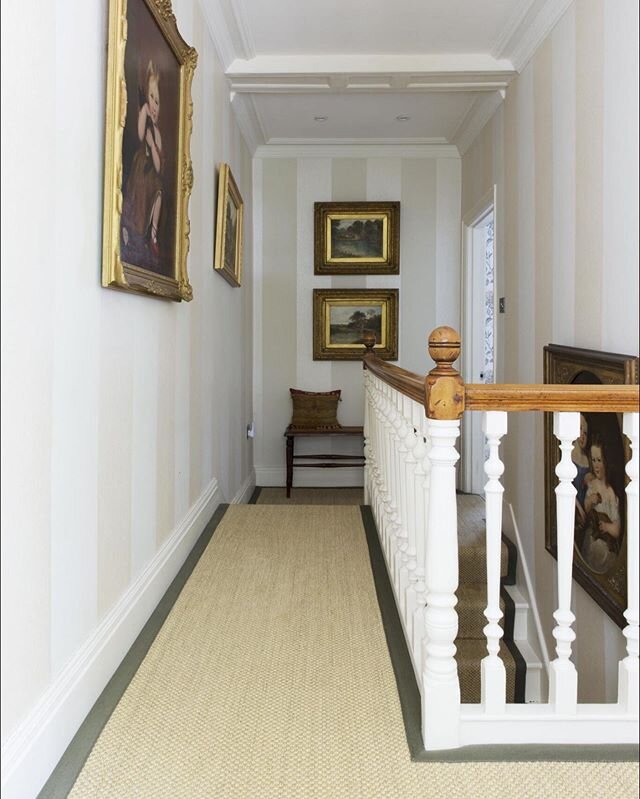 This hallway had a lot more redeeming features but it still need some more of something... so we used a more subtle wallpaper to add some detail and as a back drop to our clients art.  Trimming the Sisal with racing green added a bit of colour and in