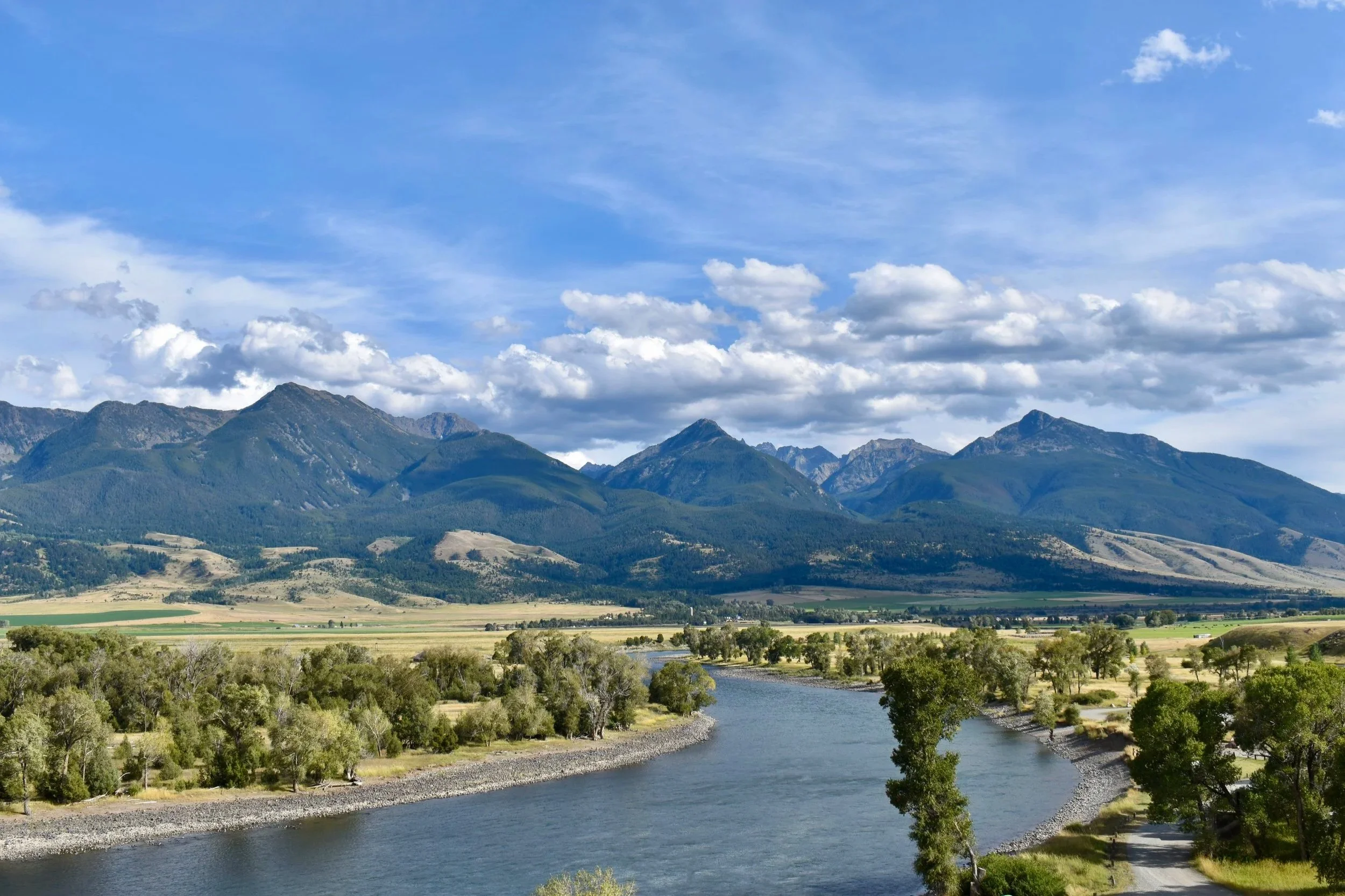 Elevated view of the Yellowstone River winding through Paradise Valley with the Absaroka Range in the background near Livingston, Montana.