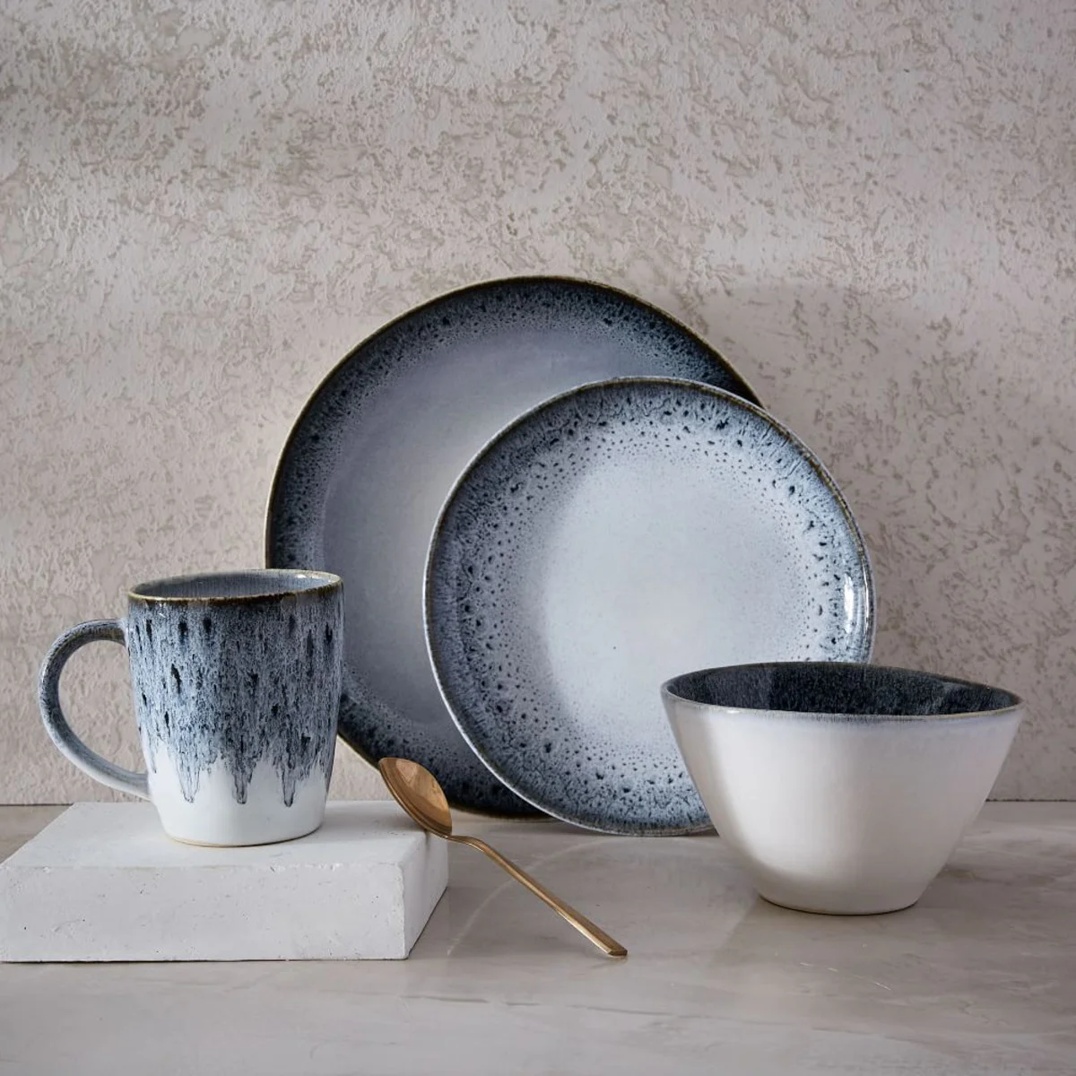 Really love this reactive glaze dinnerware set from West Elm . It’s got a bit of a retro feel and looks great with gold cutlery…