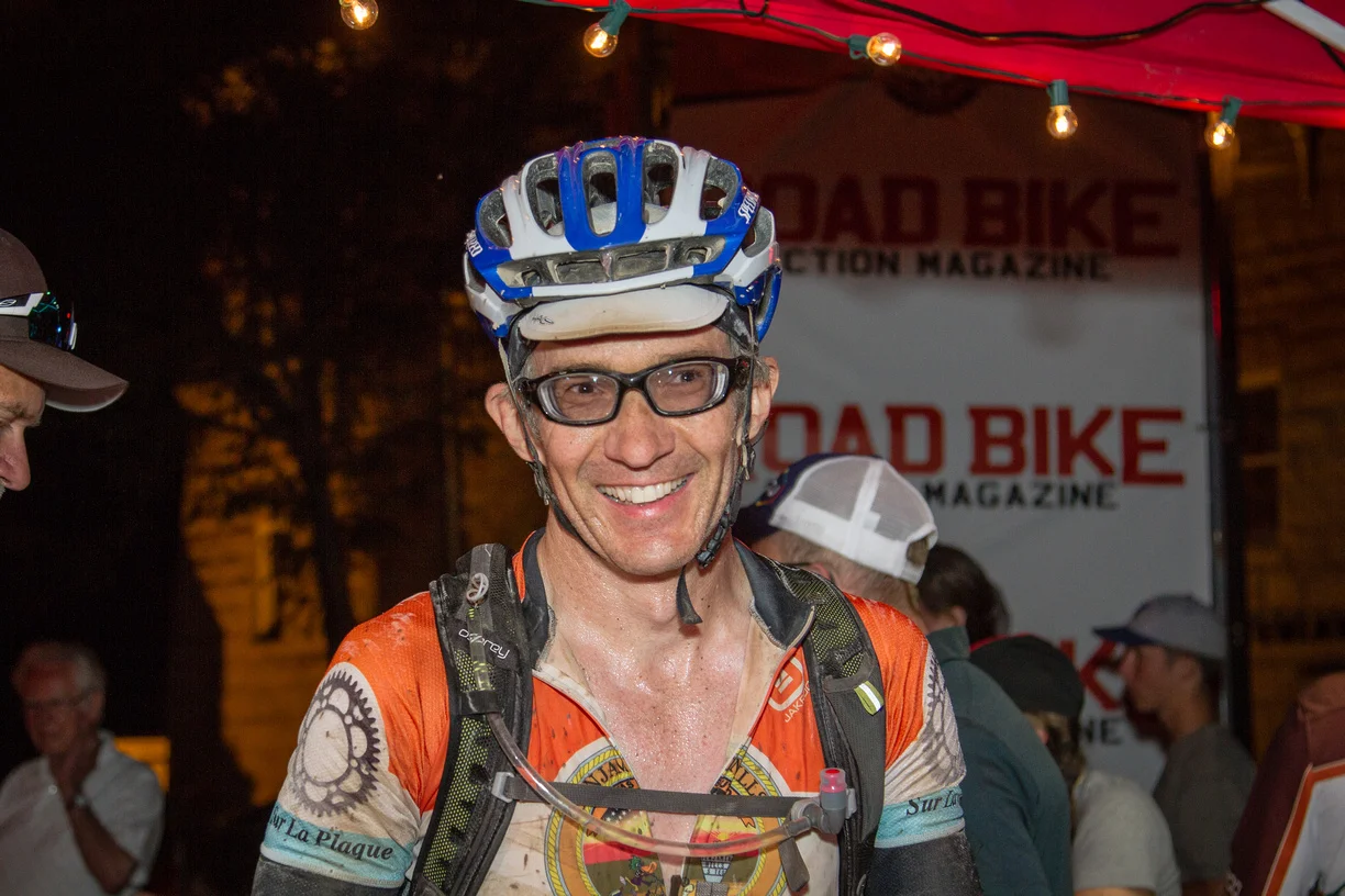 That guy looks so happy to be off his bike. 