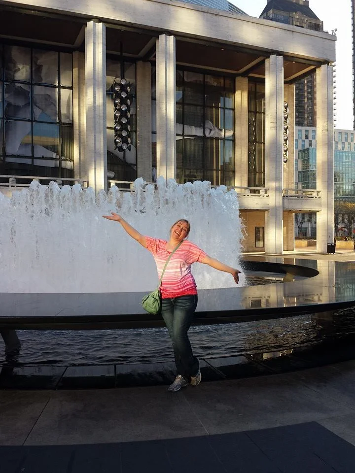 Me at Lincoln Center, thrilled to have survived the trip!