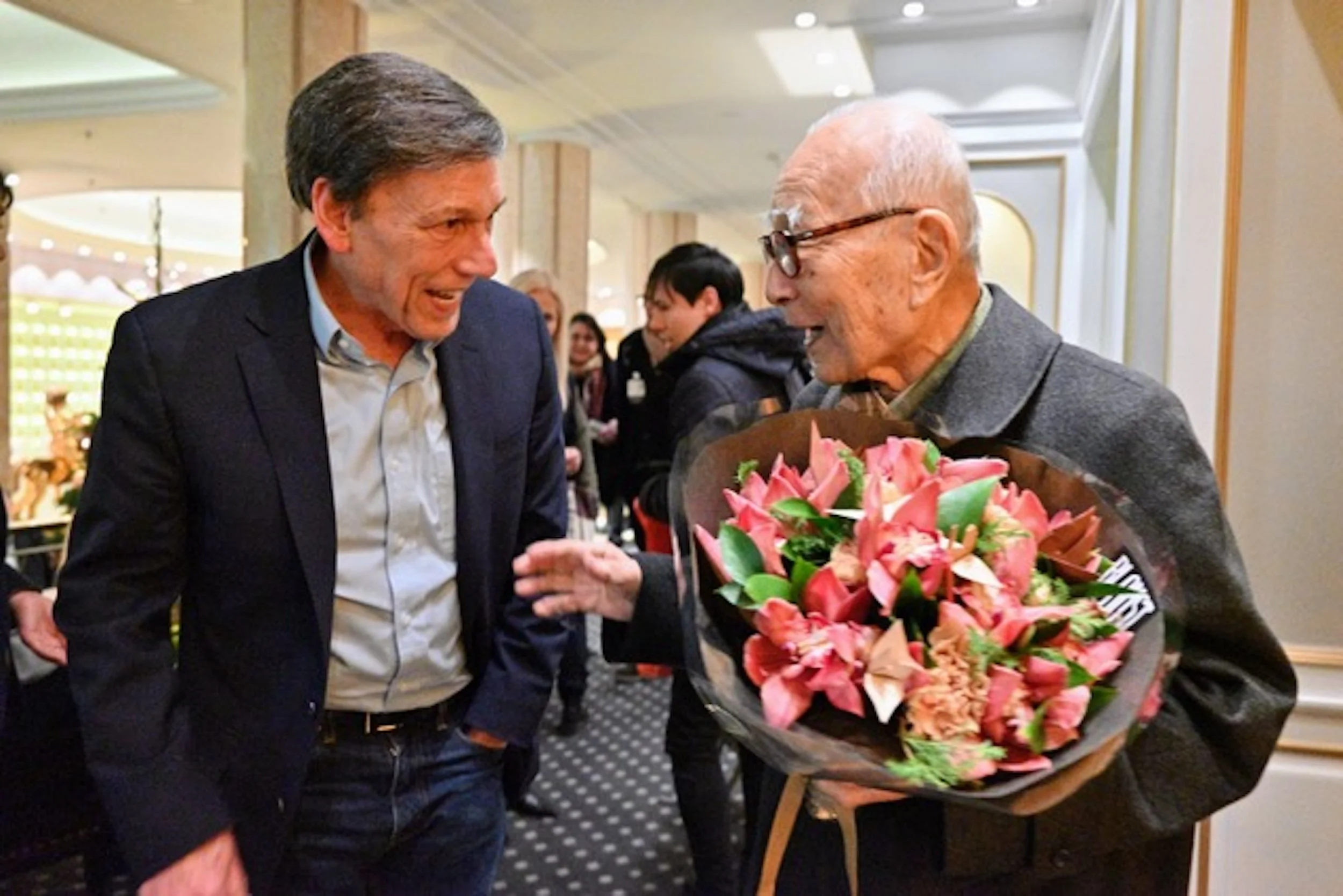 PHOTO: Peter Kuznick greets Mr. Tanaka in Oslo before the Nobel Peace Prize ceremony. Courtesy of Peter Kuznick.