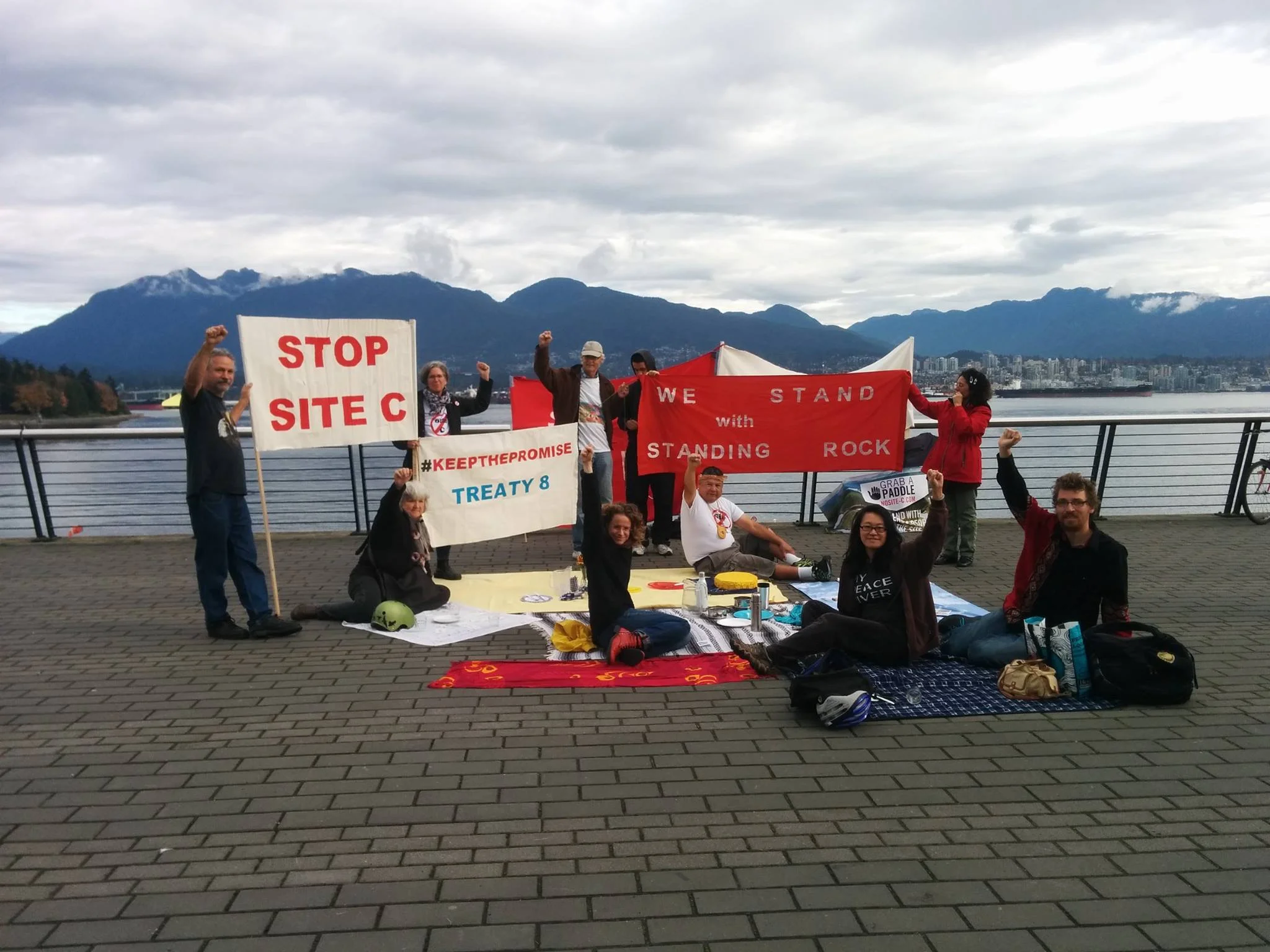 Photo of "Picnic for the Peace" in October 2016, where members of FightC and the public gathered with empty plates in solidarity with the Deeds Not Words Indigenous Day of Action