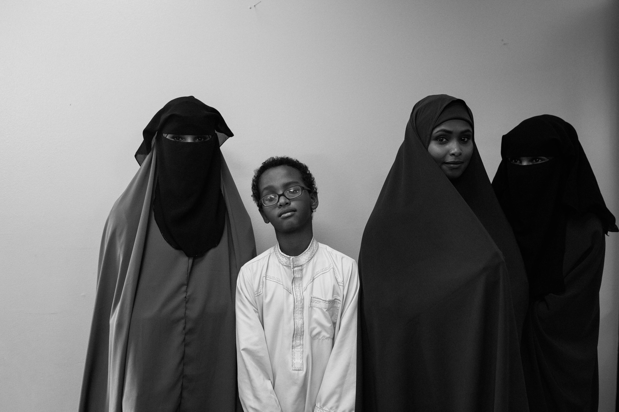 From left to right, Ridwan Ali, Abdirahman Ali, Zainab Mohamed and Misra Jama smile for cameras as the press conference comes to a close. 