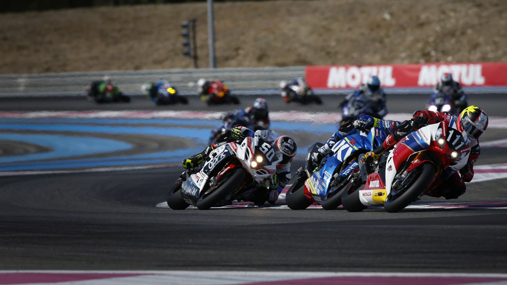 Racing tyre to tyre is surprisingly safe, thanks to controlled environment. Photo: Honda
