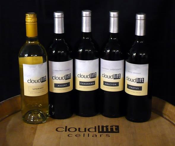 Image of Cloudlift Cellars wines on a wine barrel.