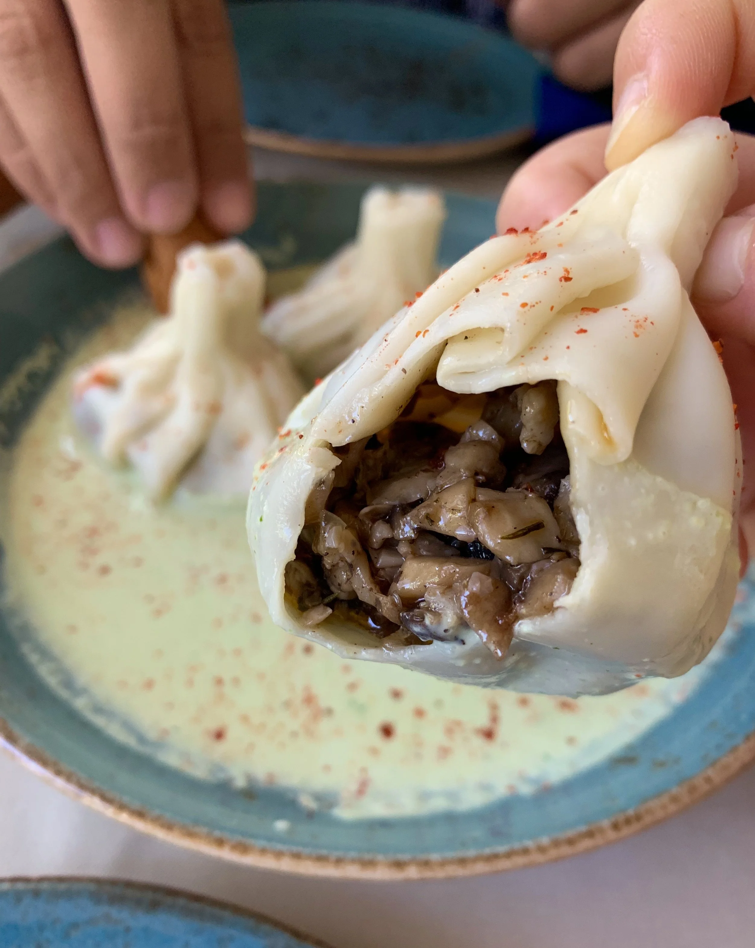 Mushroom khinkali with white sauce