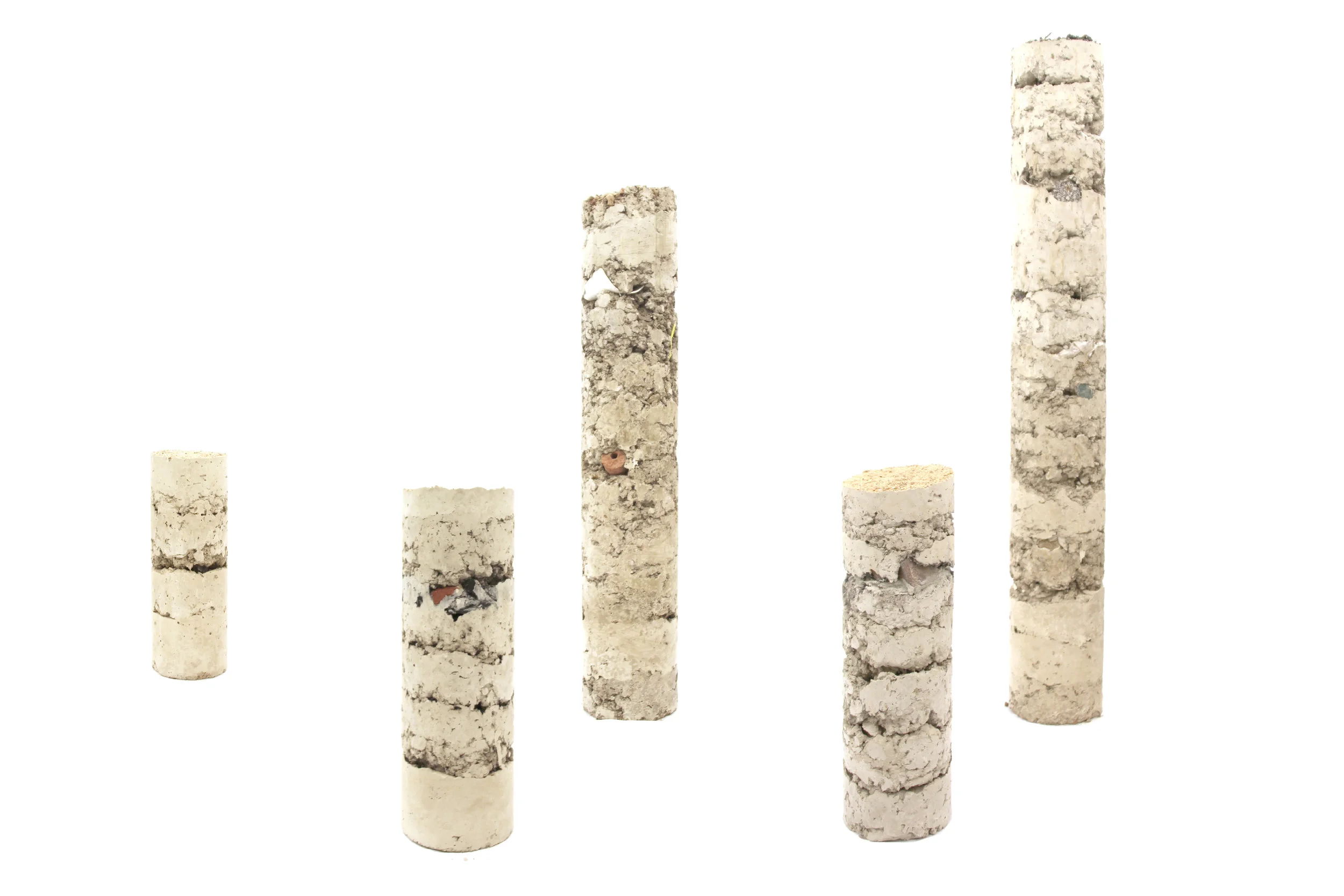 Soil (with everything it contains) and cement. Approximate Core site marker prototypes.