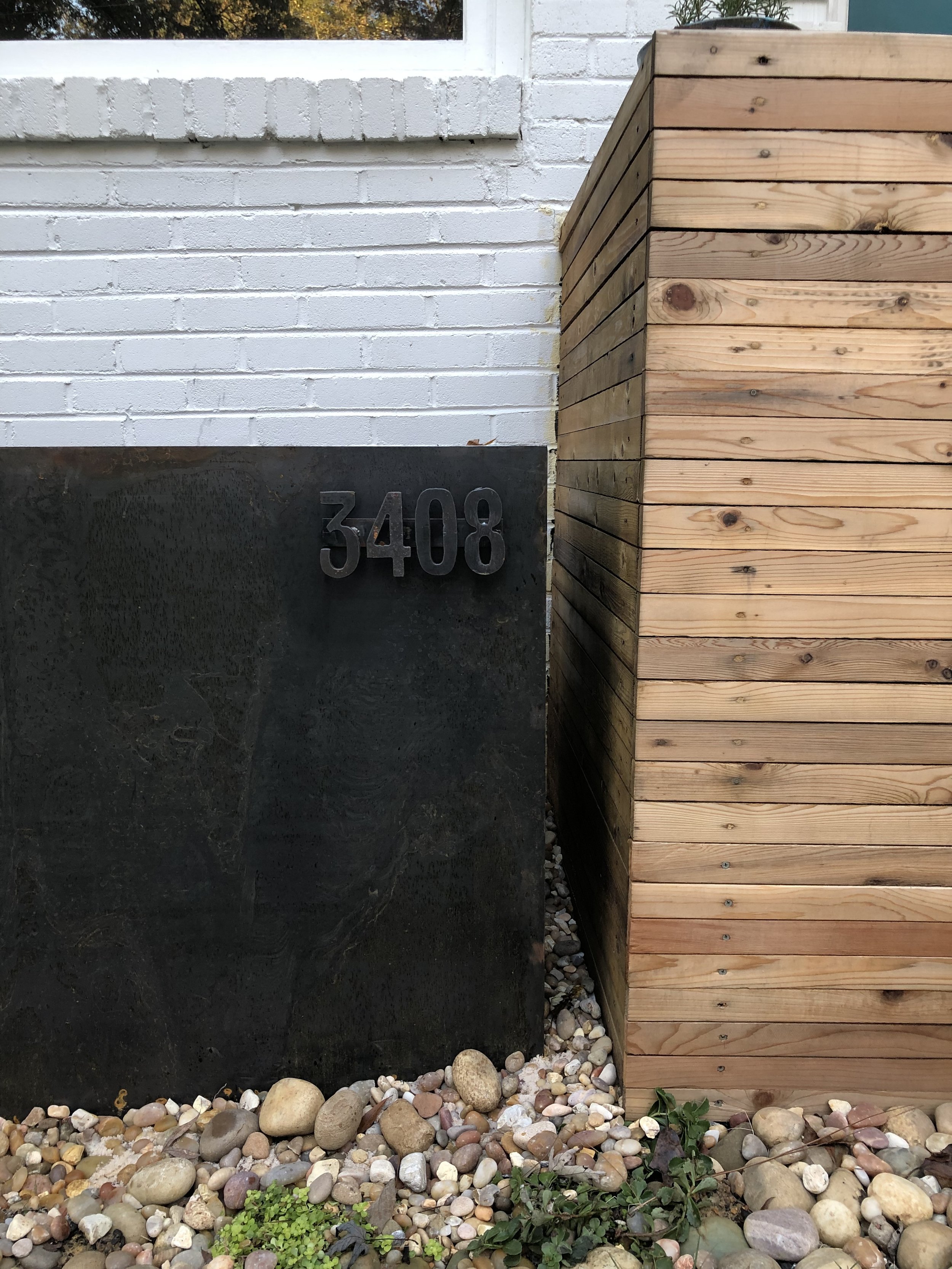 House number detail on cortex planter.