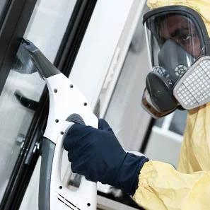 Chemcare technician decontaminating home after biohazard scene