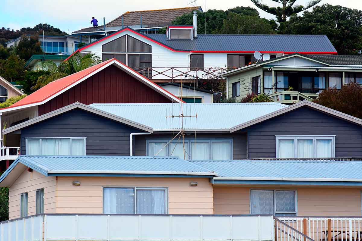 How might New Zealanders still be exposed to asbestos