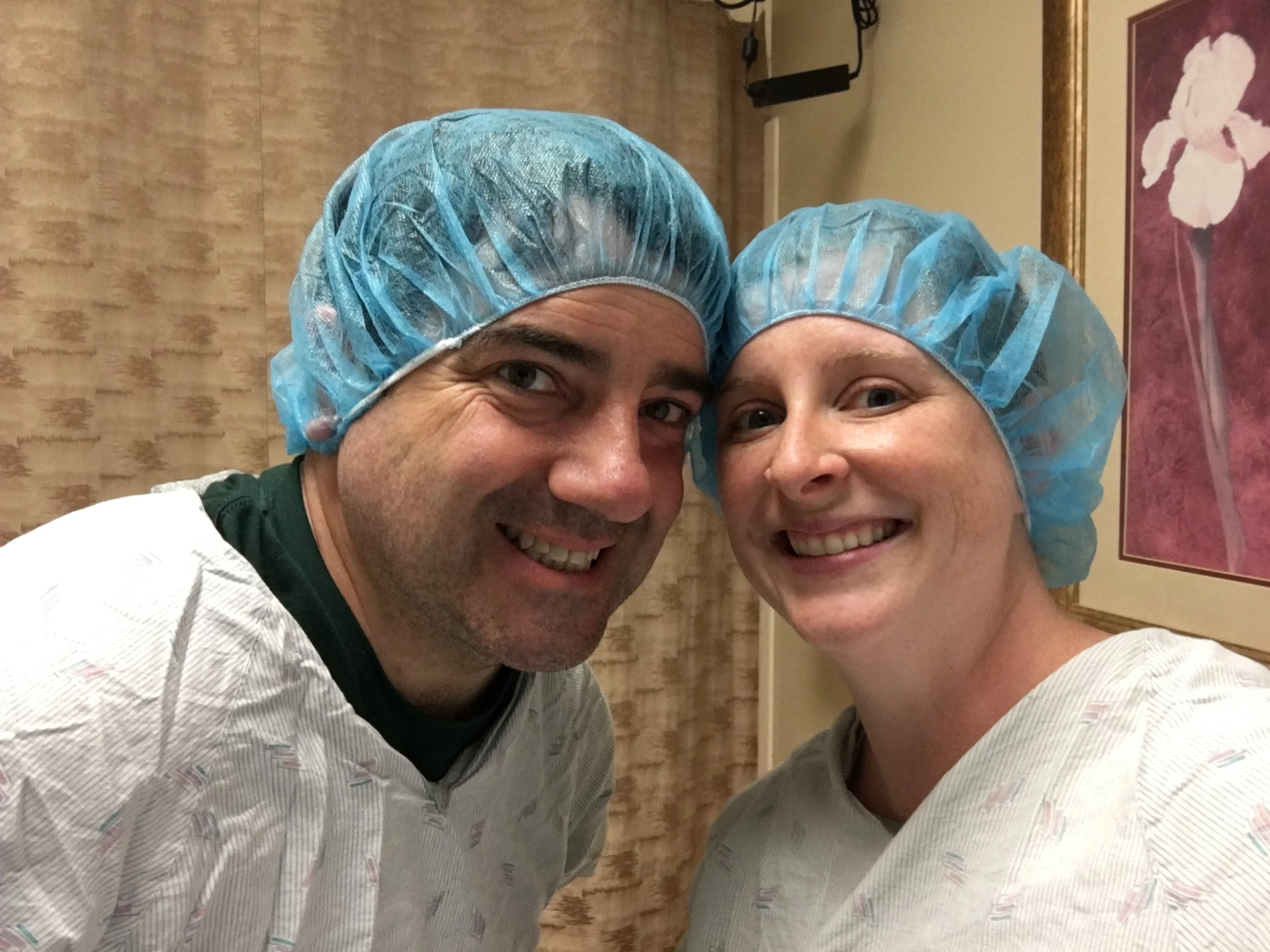 Jim and me on the day of our egg retrieval as part of IVF. Should we discriminated against for doing this when there is no other way for us to have a biological child?