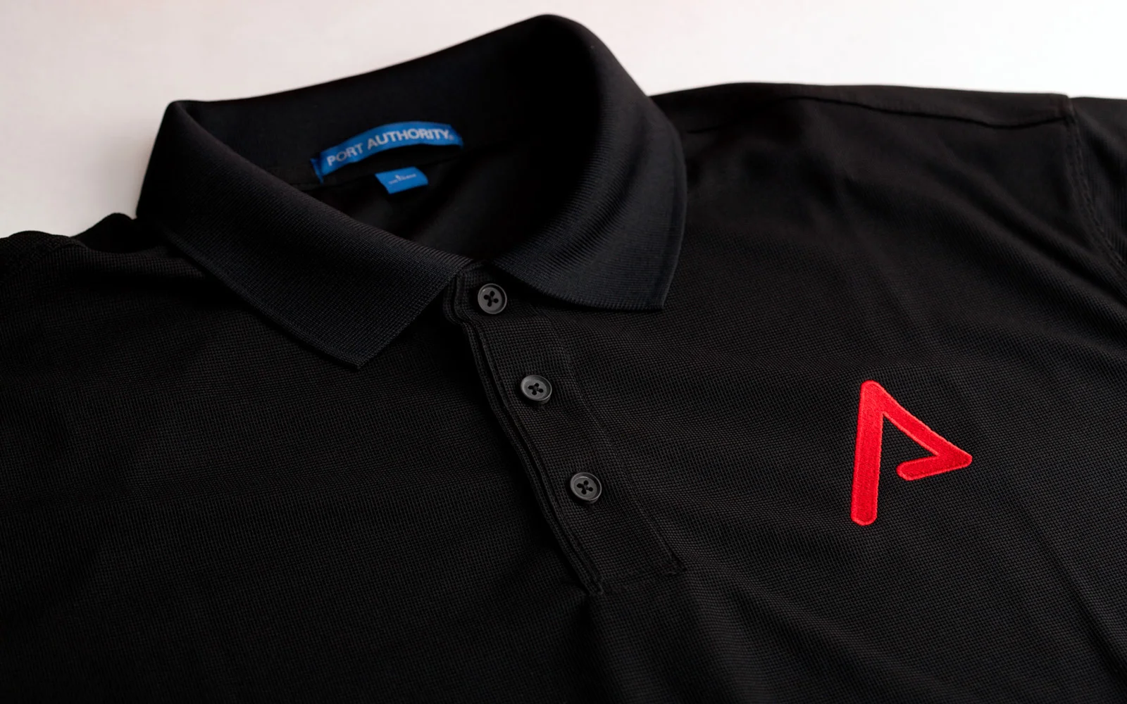 I love the way the red color pops on the black polo!