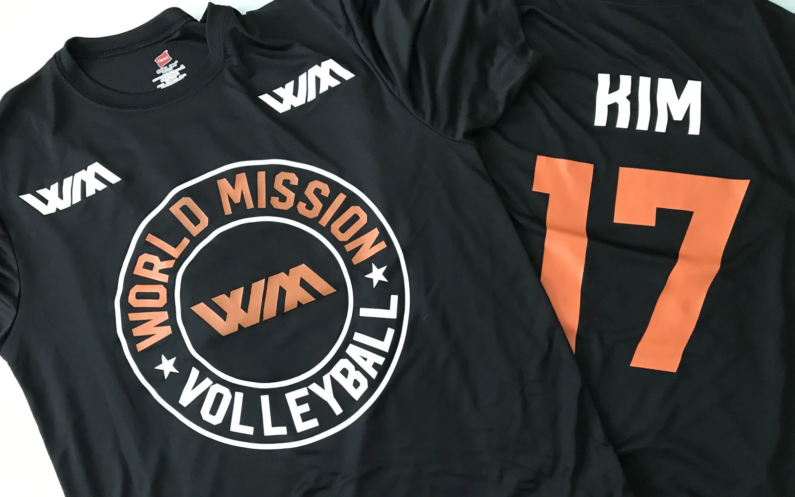World Mission Volleyball shirts. The front was screen printed and the names and numbers were printed using fashion film. I love how sweet the White and Orange stand out on the black Dri Fit shirt. And it's a nod to the SF Giants!