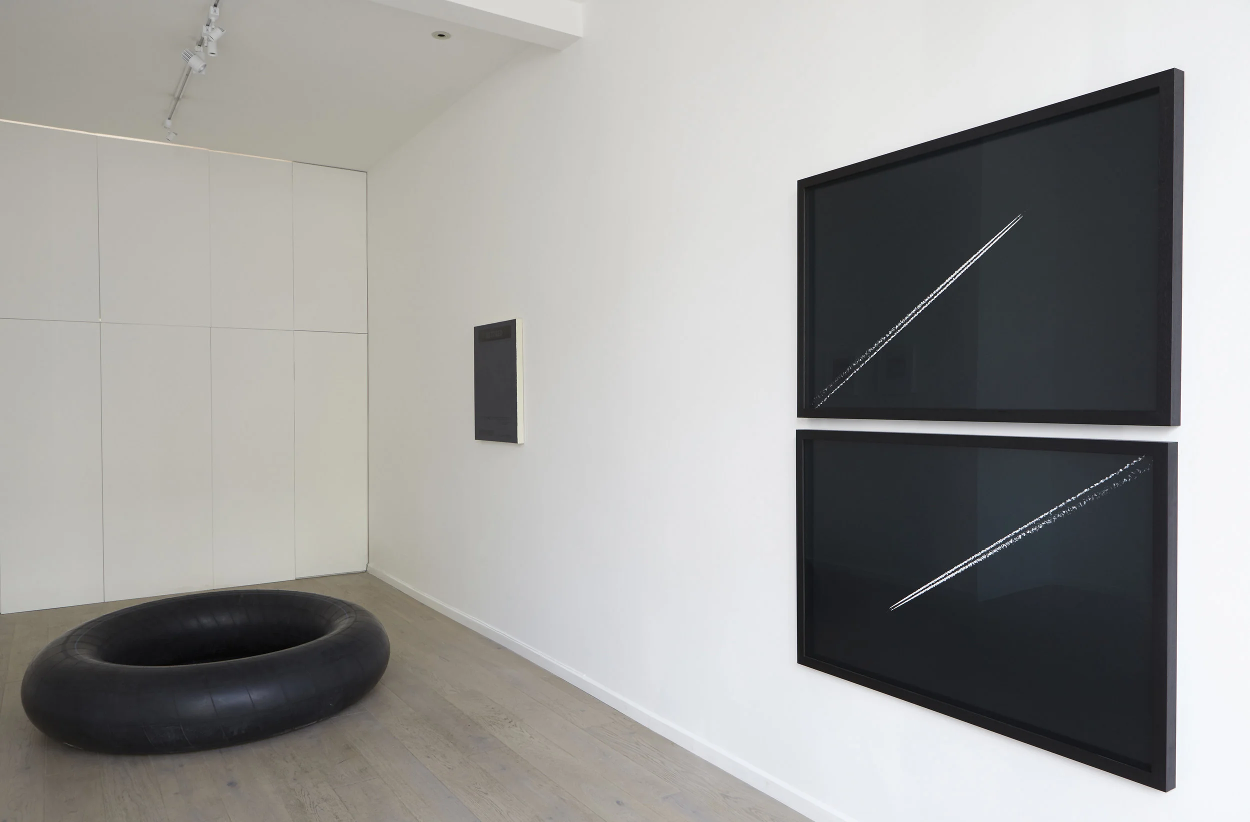 Kingsley Ifill 'Squared circle', 2016, Television, inner tube, one tube of compressed air. (Piece completed once all air has naturally diffused through rubber). Dimensions variable. Kingsley Ifill 'Unpredictable', 2017, Acrylic on canvas. Alex Sain 'Fight or Flight' 2017, Pair of identical Ra4 prints with negative