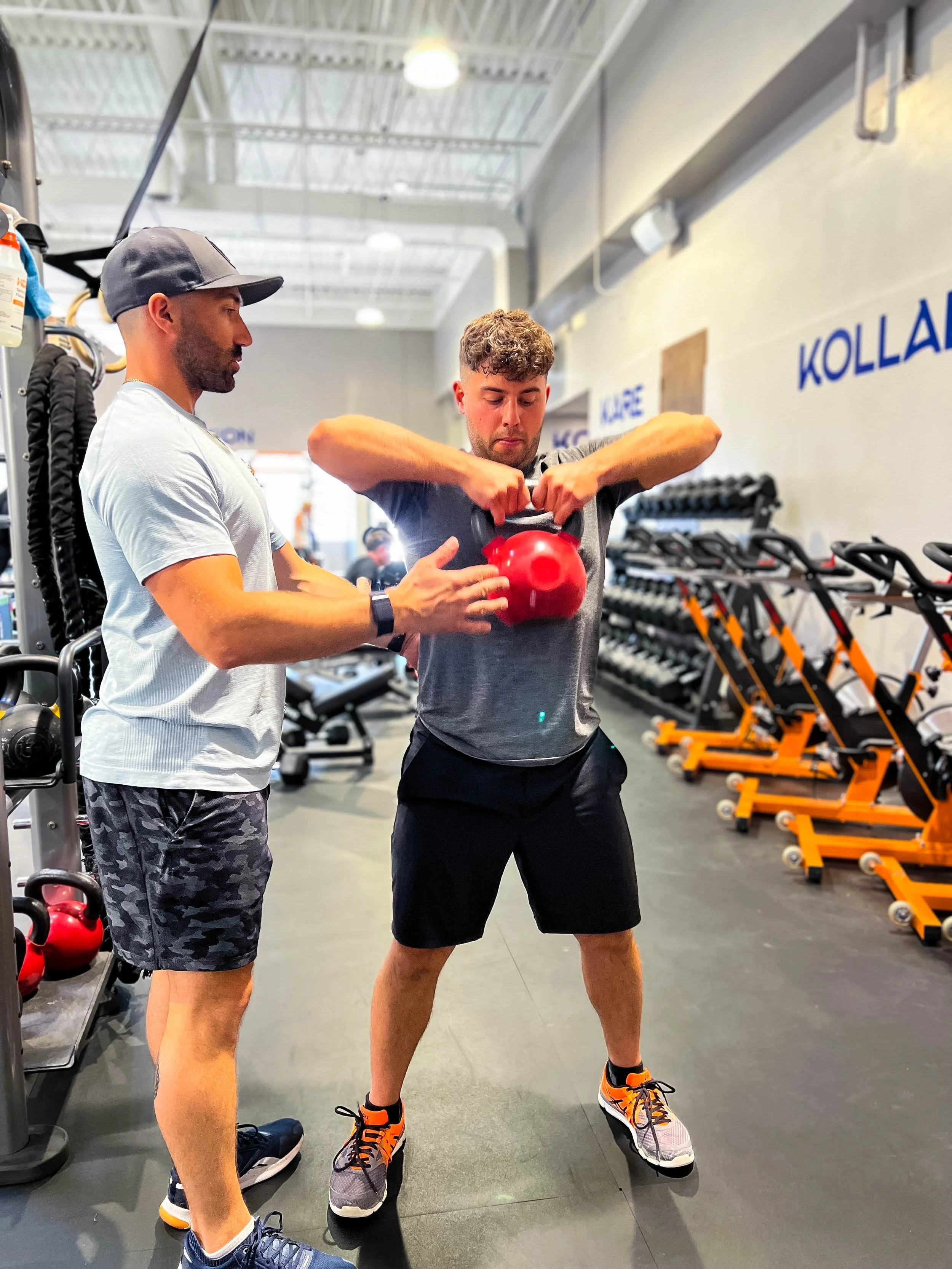 deadlifts with a client at a wellness studio in the West Island of Montreal