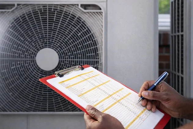 HVAC staff with check list