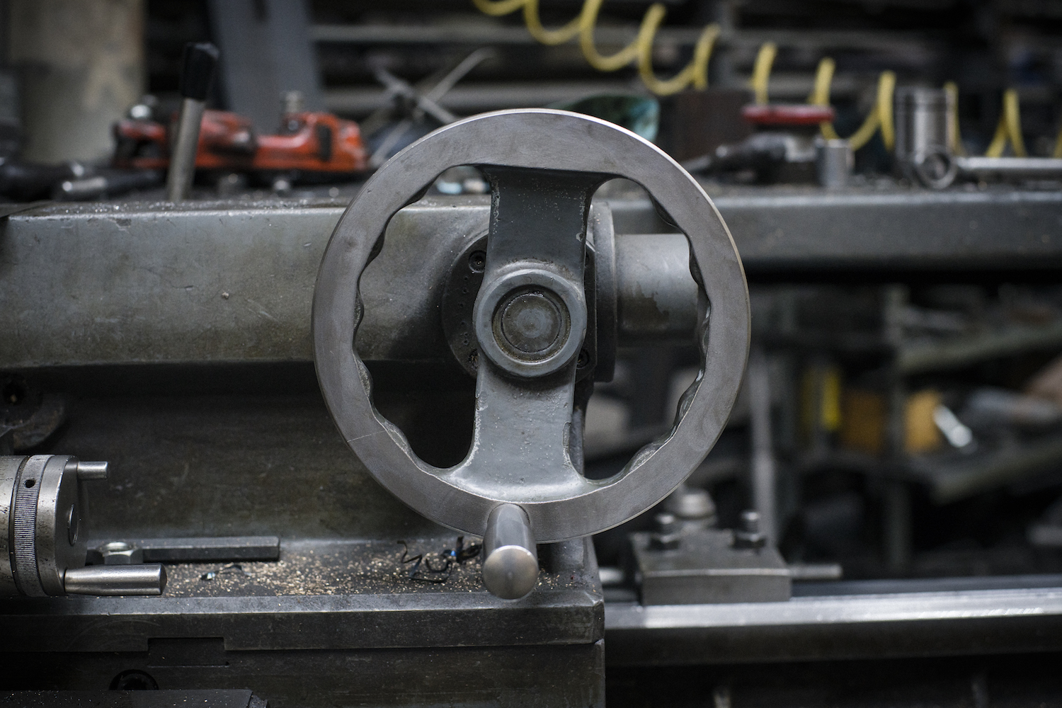 Martin Holland, Anneal Business Coaching, article header image of a machine handwheel in a shop for “They Say I Make Money, So Why Don’t I Have Any?” on profit vs cash flow