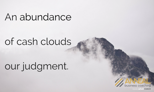 Martin Holland, Anneal Business Coaching, quote graphic: “An abundance of cash clouds our judgment.