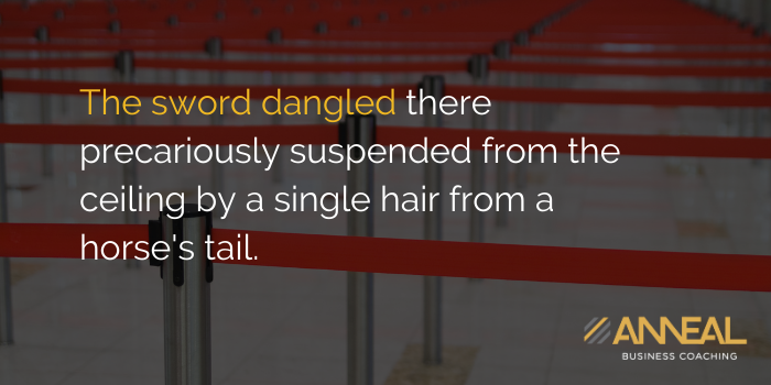 Martin Holland Anneal Business Coaching - The sword dangled precariously suspended from the ceiling by a single hair from a horse's tail, symbolizing business owner burden and risk