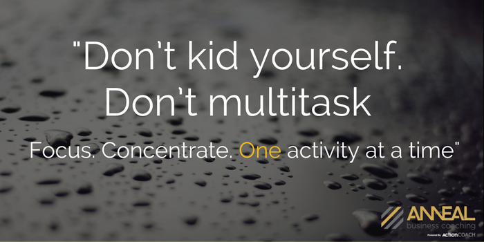 Anneal Business Coaching graphic from Martin Holland reading "Don't kid yourself. Don't multitask. Focus. Concentrate. One activity at a time," over a dark water-droplet background.