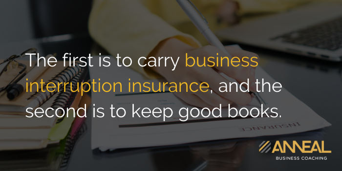 Anneal Business Coaching quote graphic from Martin Holland over a photo of a person writing next to an insurance document and laptop, reading "The first is to carry business interruption insurance, and the second is to keep good books.