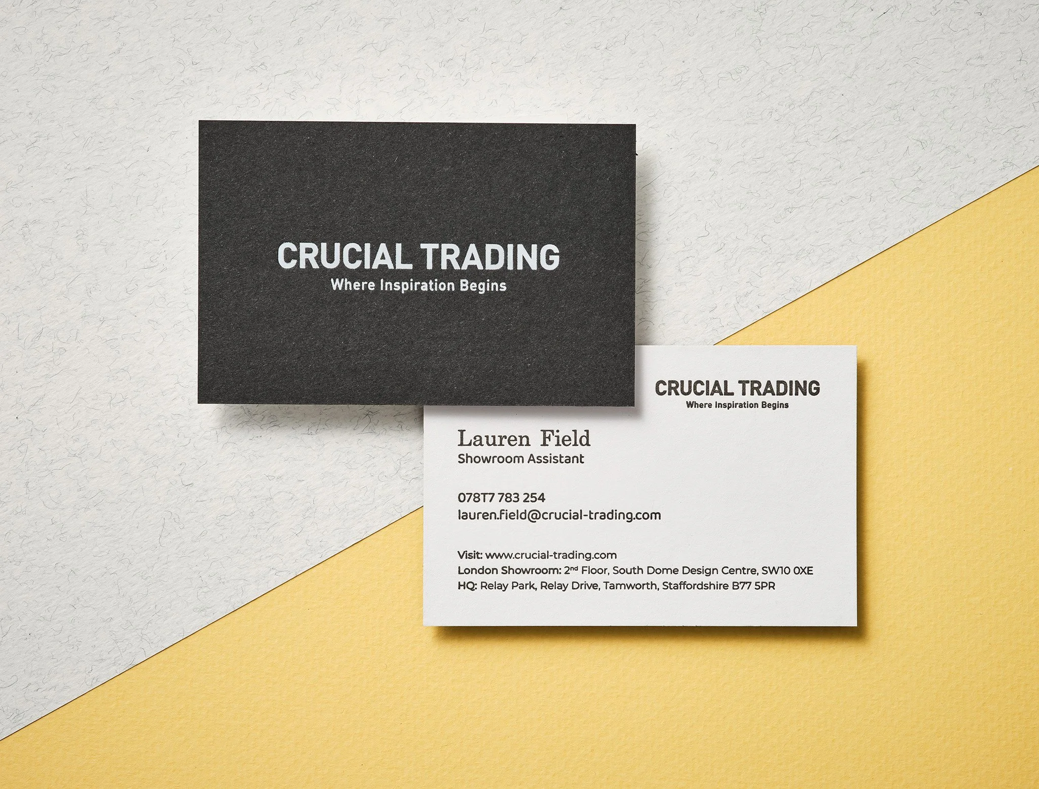 White foil business card with black letterpress on black and white recycled duplex stock