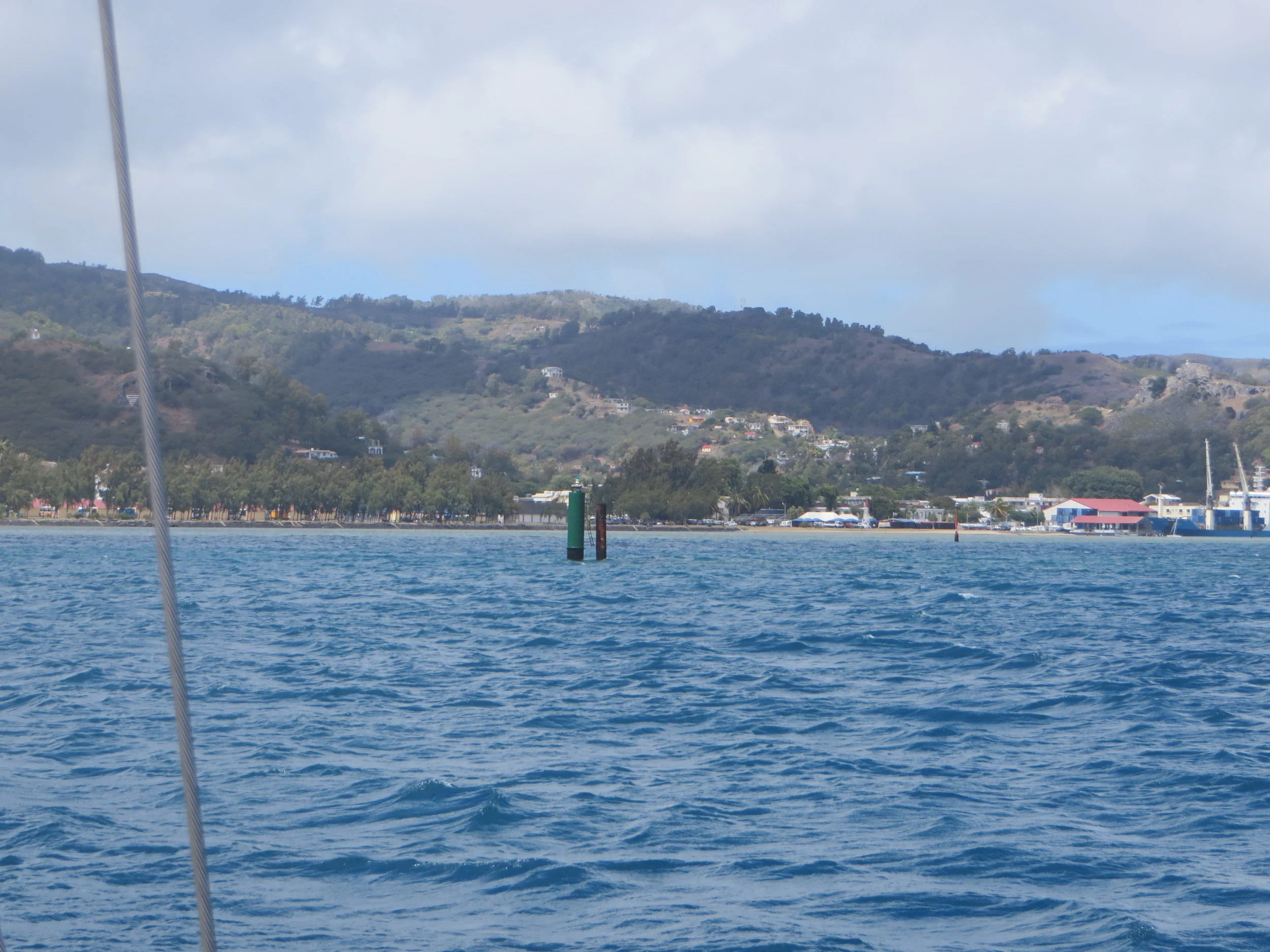 Land ho! After a night of heaving-to, Green and red markers showed us the circuitous way into the Port Mathurin harbor.