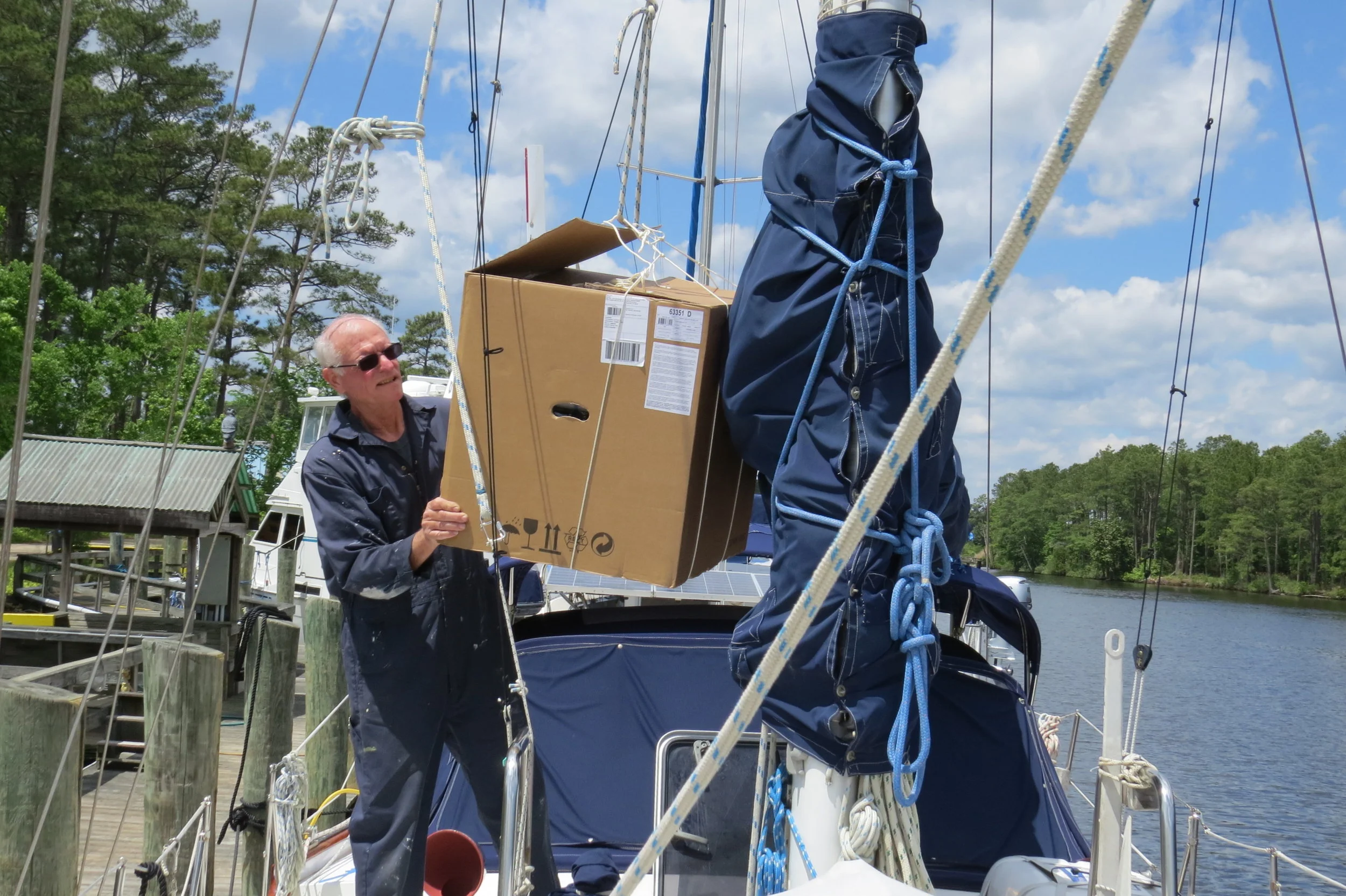 We used the windlass to hoist it up and lowered it through the saloon hatch.