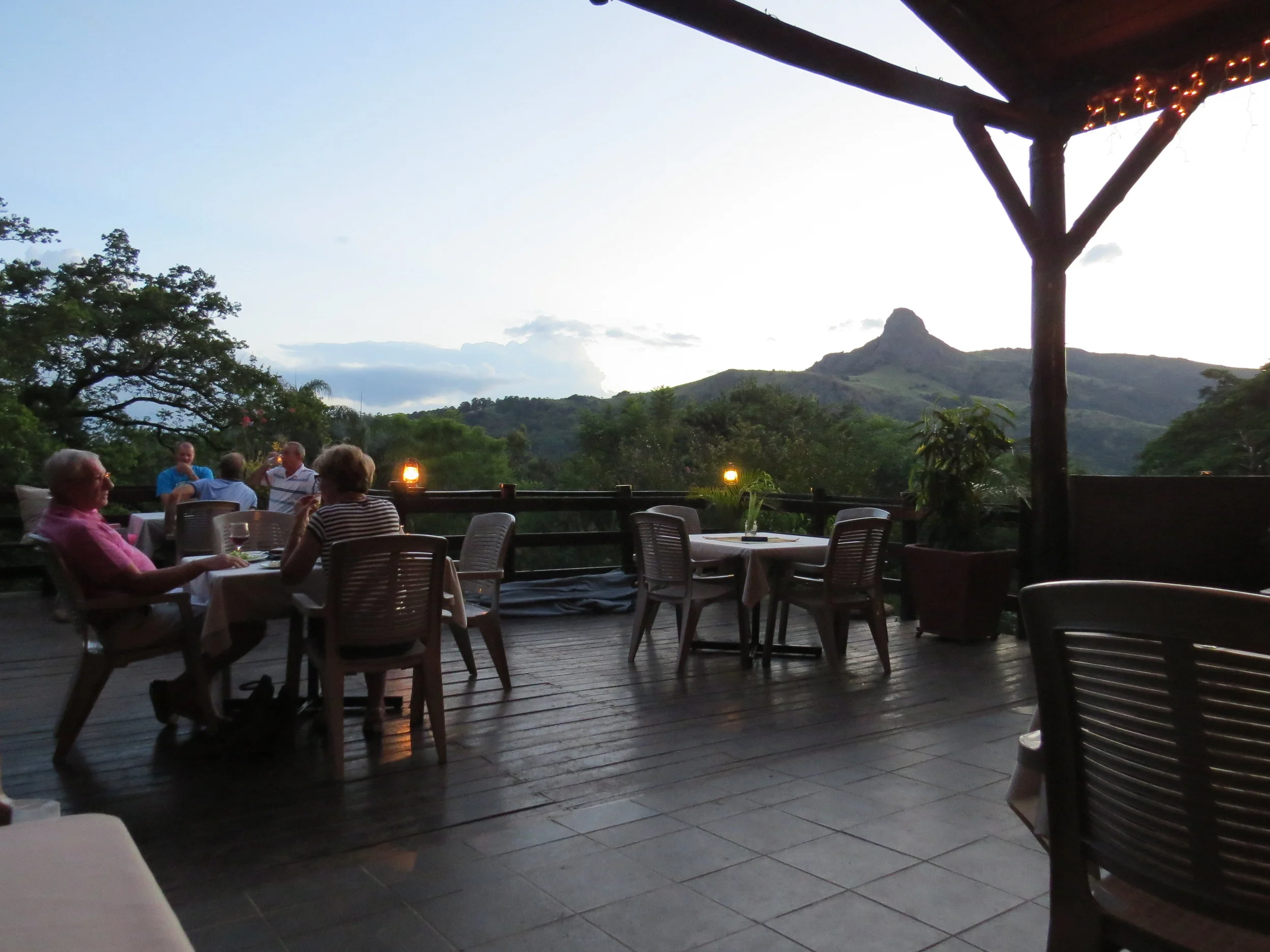 Casual dining at the Mantenga Lodge with a view of Execution Rock in the distance
