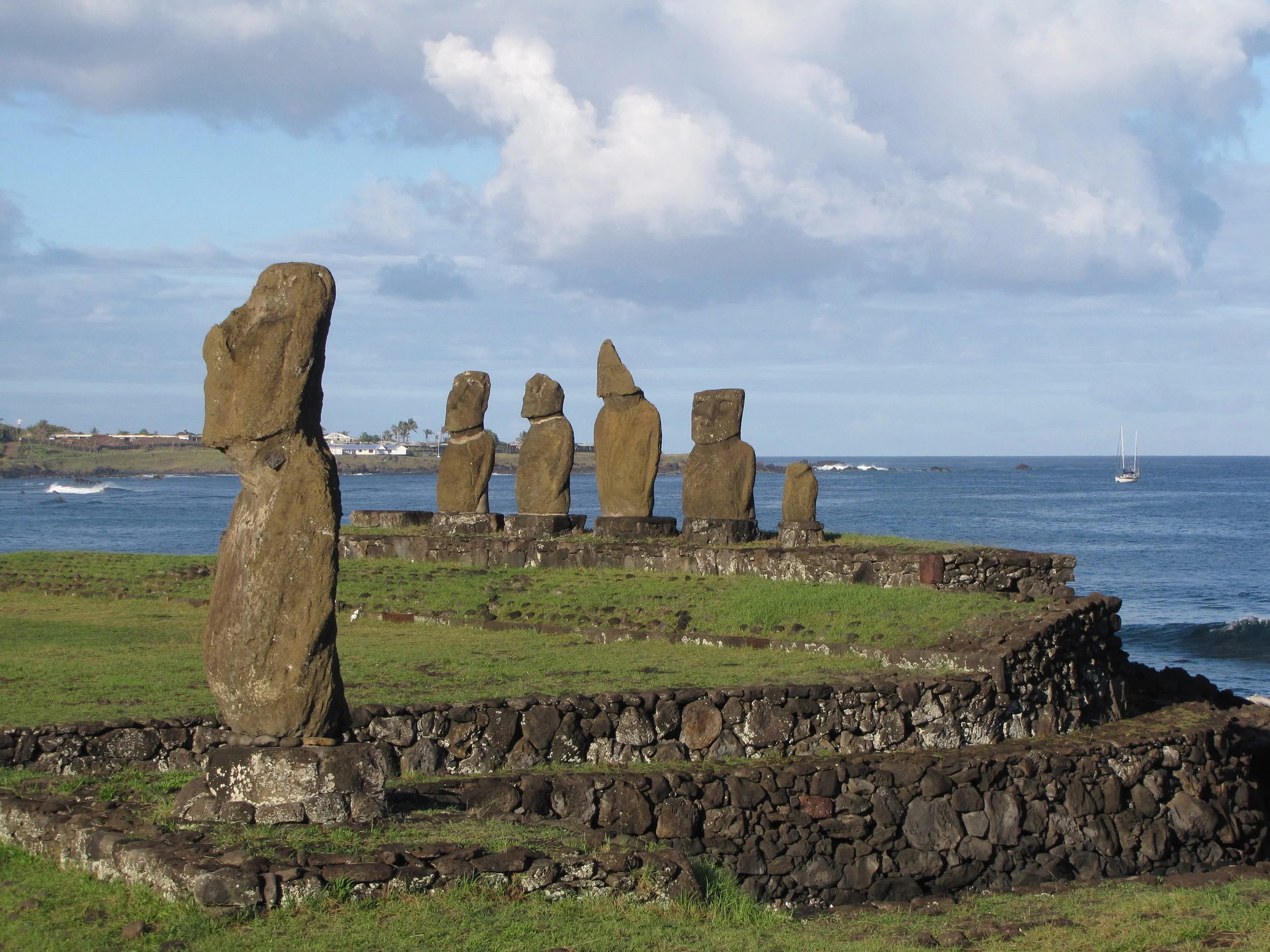 Moai on the shore at Hanga Roa with Nine of Cups anchored in the background.