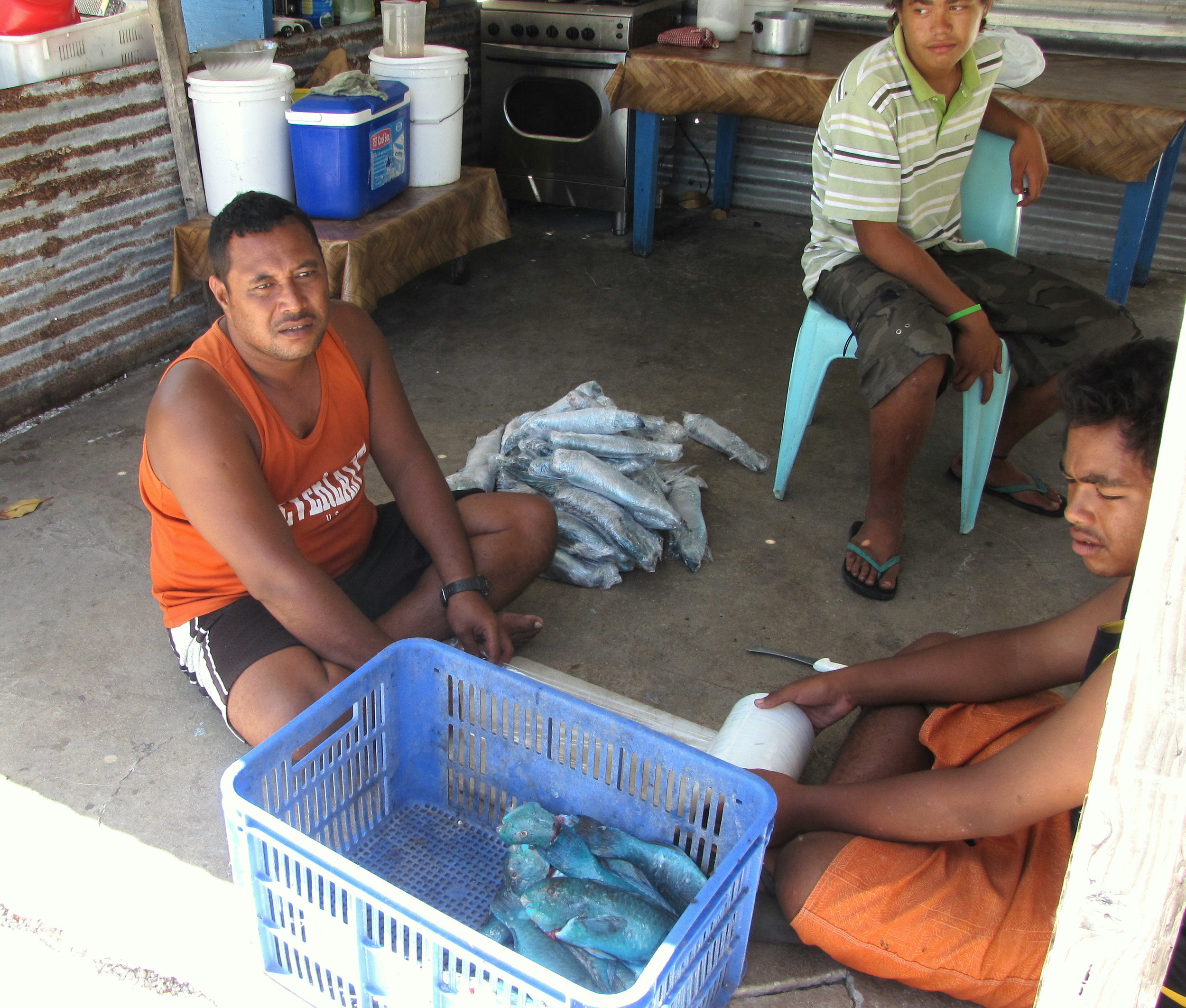 Fishermen with their parrot fish catch.