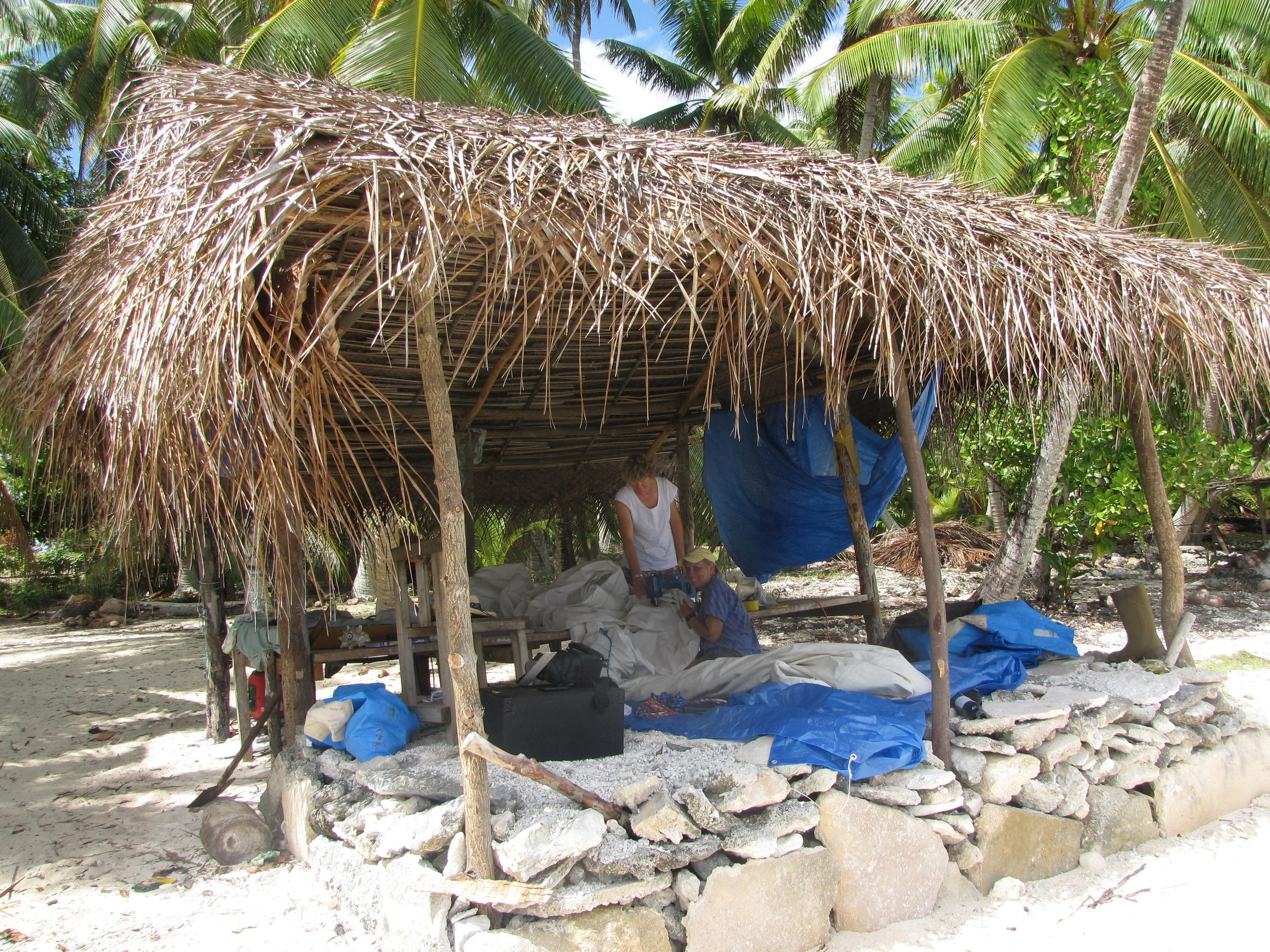 We lugged the generator, sewing machine and sail ashore and rigged up a sail loft for the repairs.