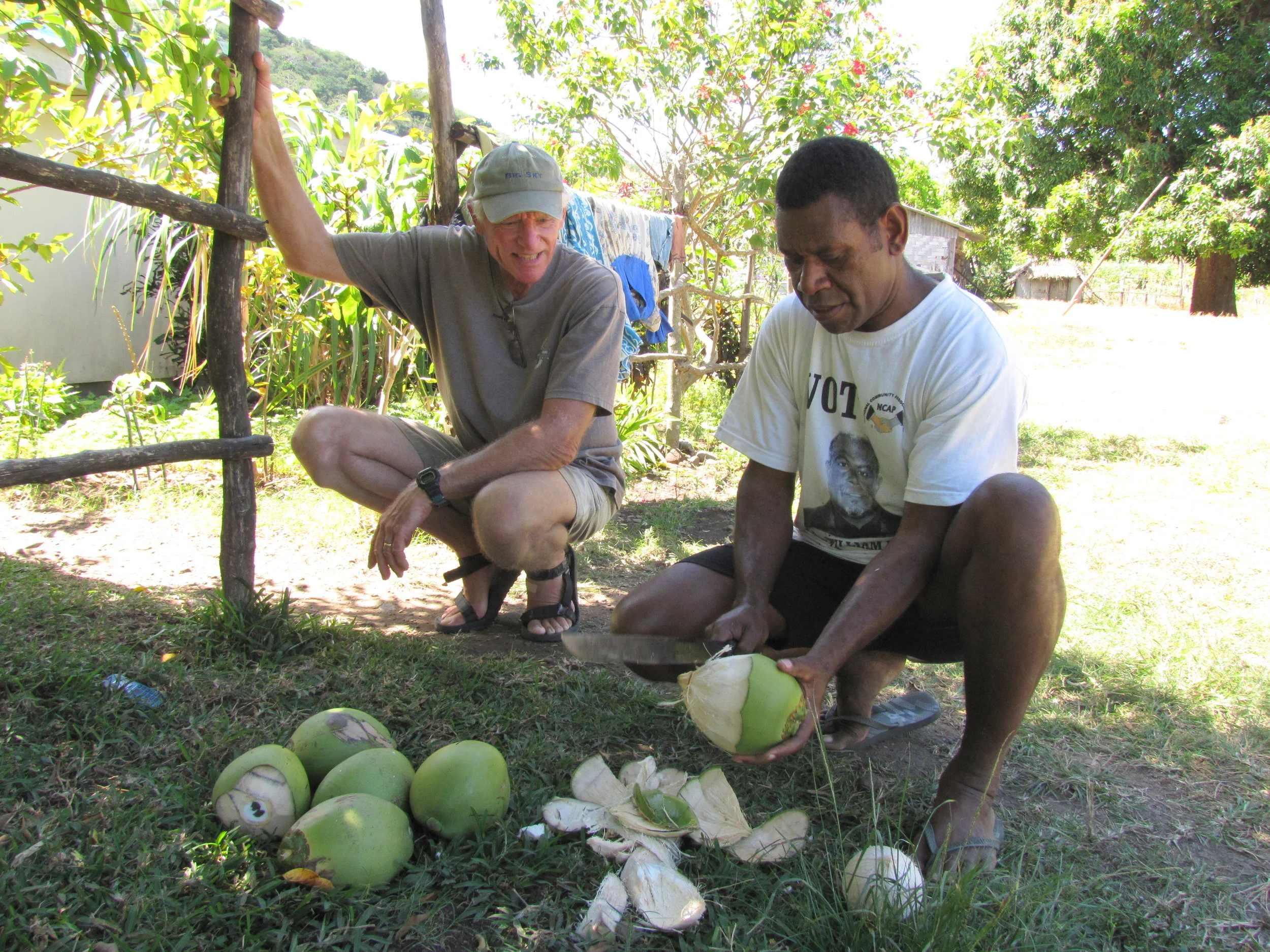 The local minister, Robbie, gave us a tour of the village as well as showing David the correct way to open green coconuts.