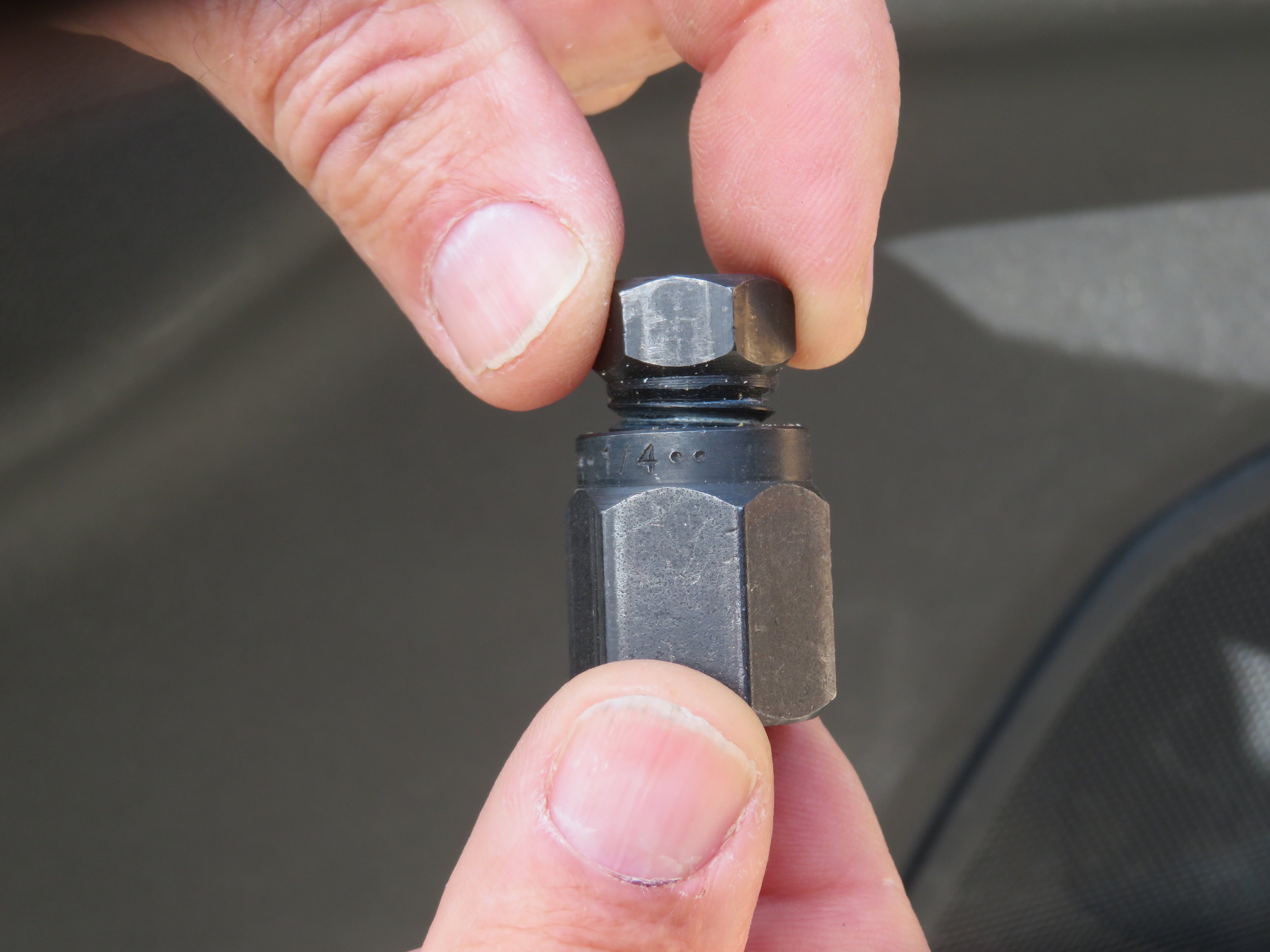 1. Screw the top half of the tool into the bottom half. Note that they are reversed threaded.