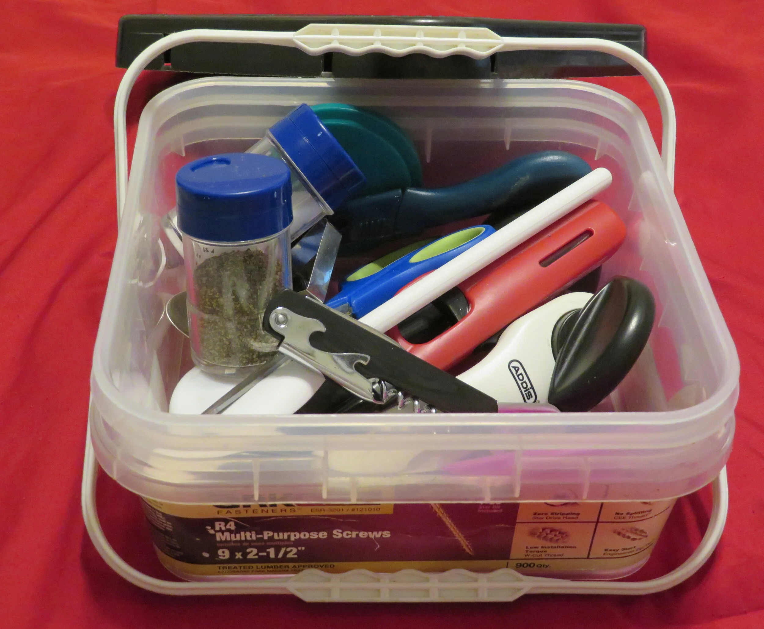 A re-purposed plastic deck screw container works great for keep all cooking utensils together.