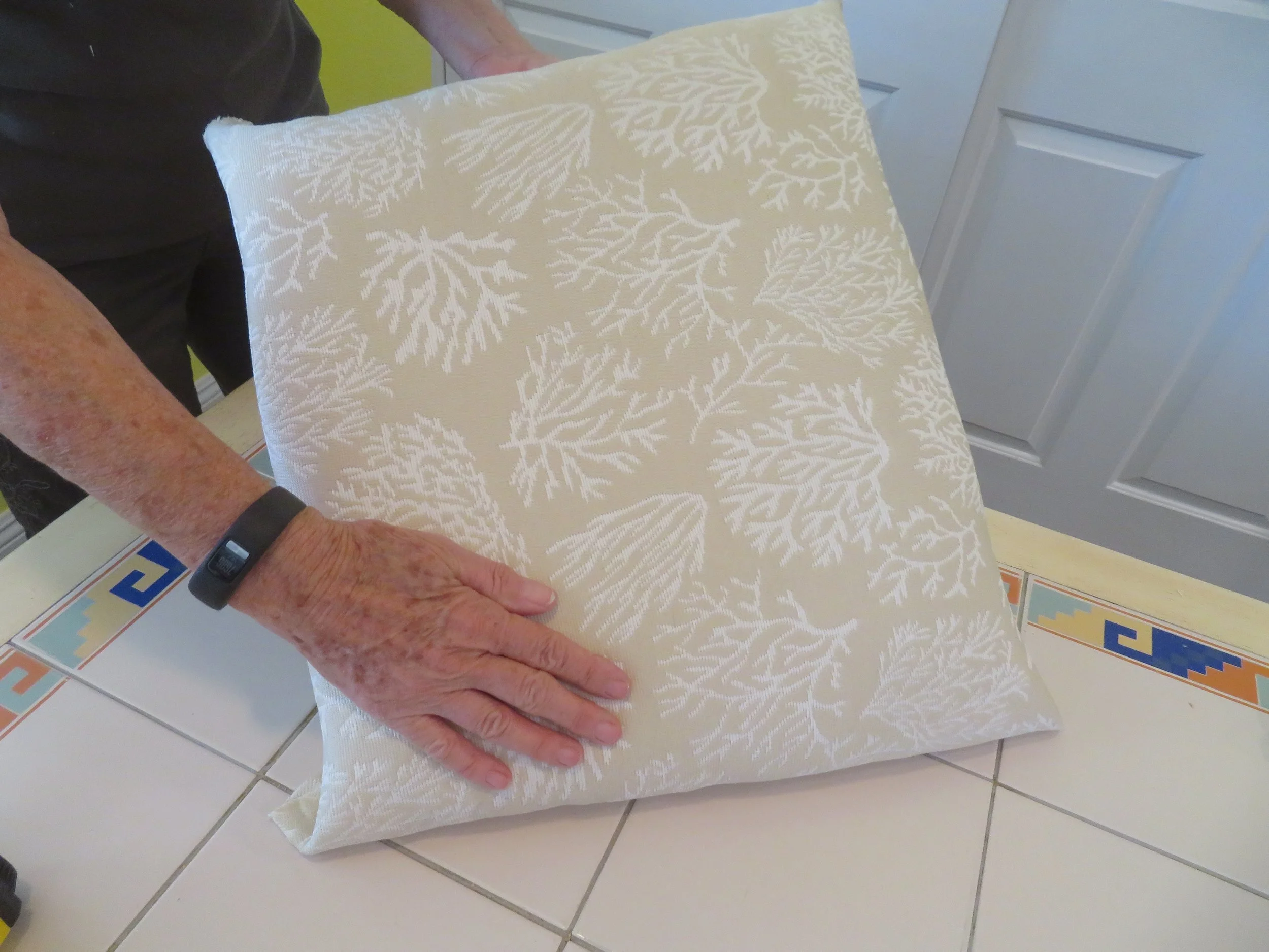 Checking the fabric was taut and straight.