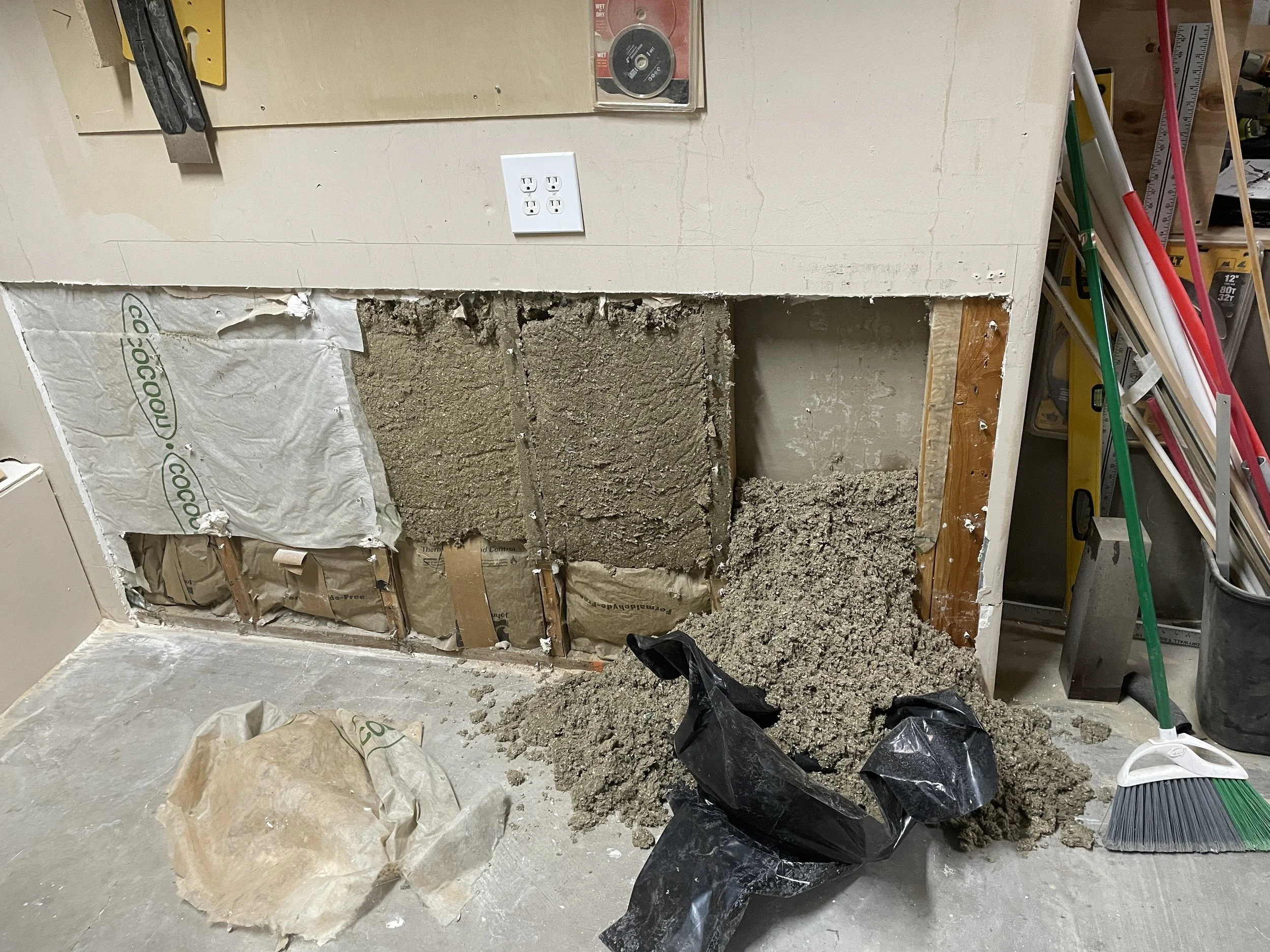 Wet insulation in garage wall