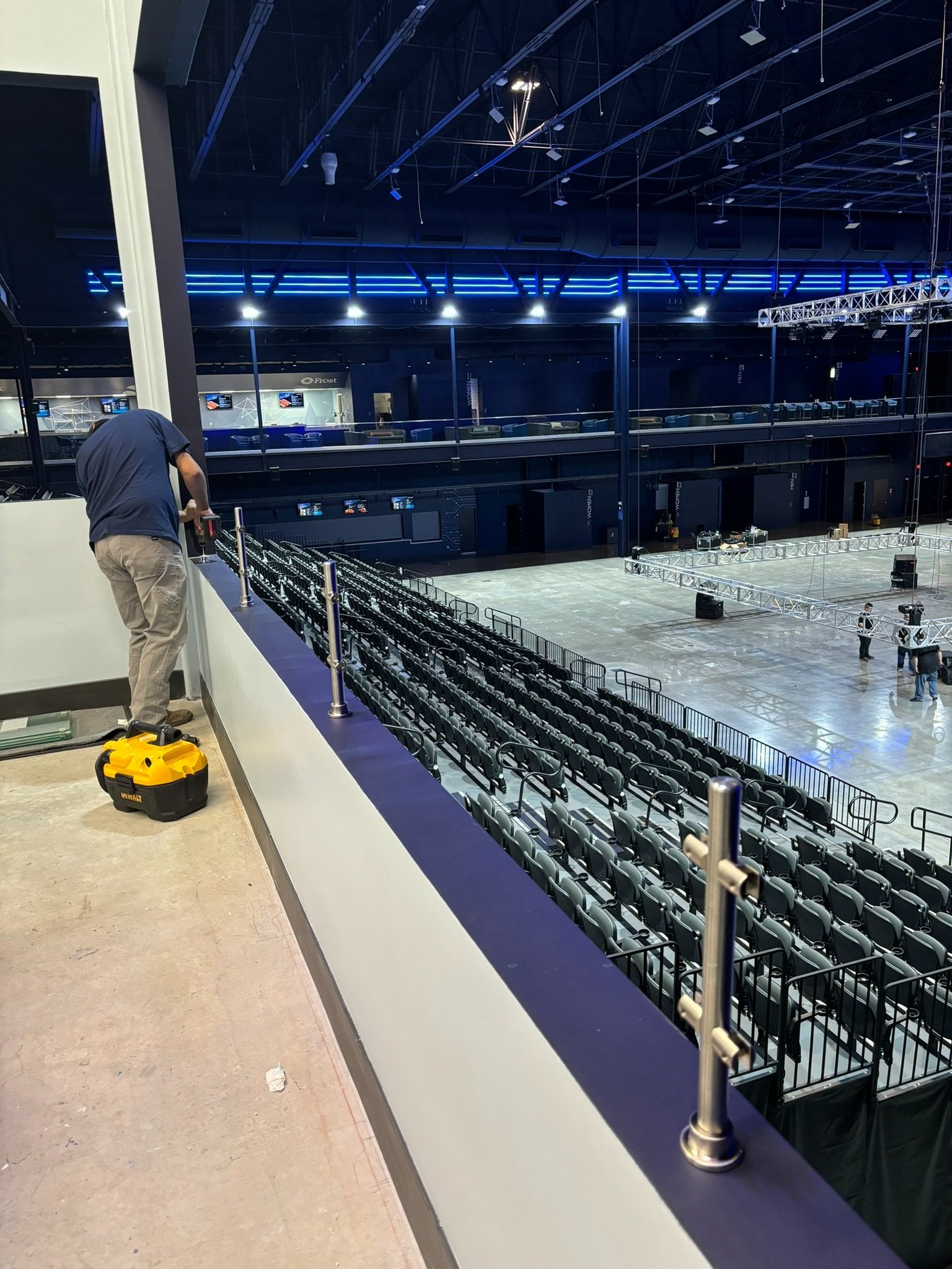 Installation of a Sneeze guard railing over balcony inside the the event center.
